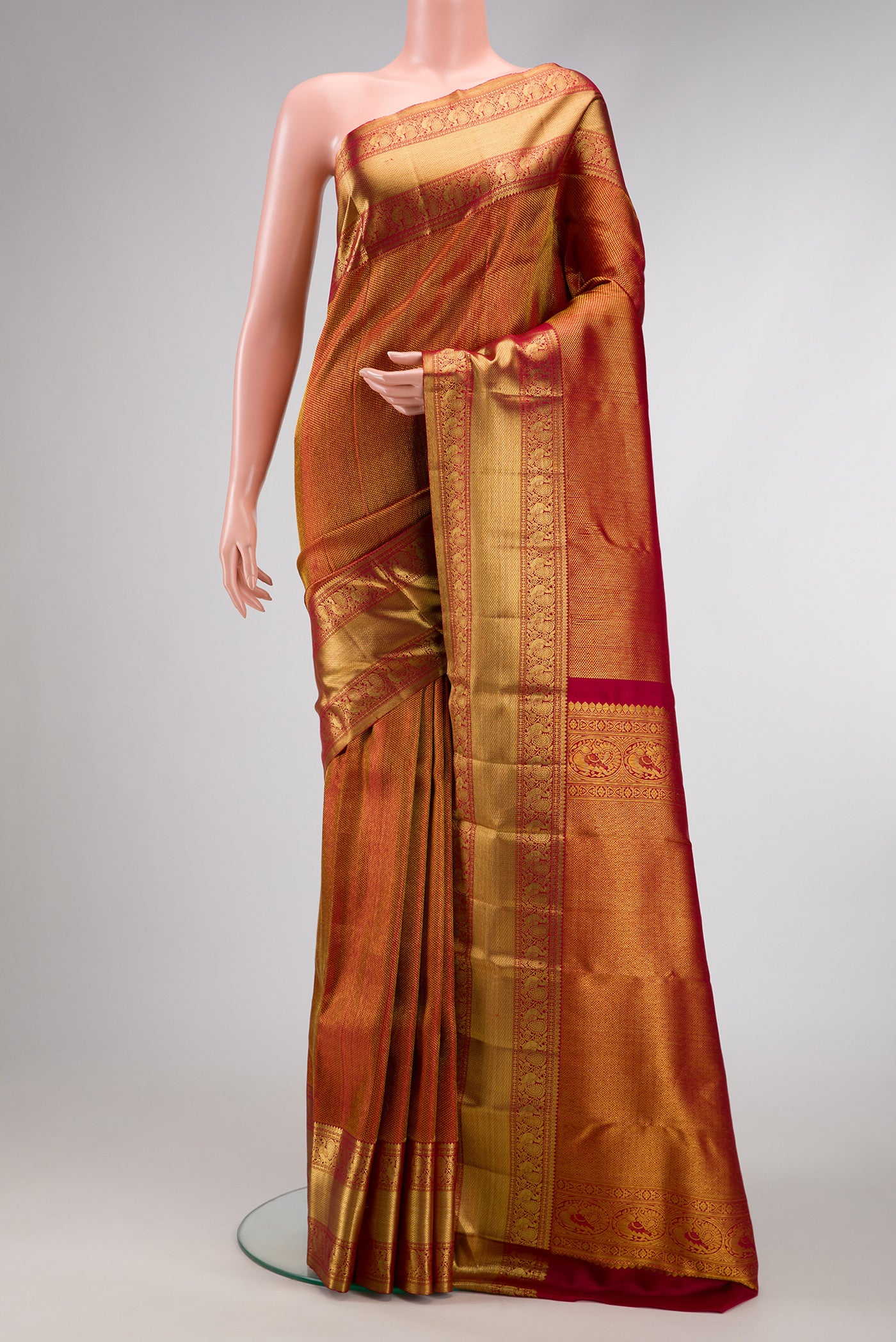 Maroon Dual Tone Kanchipuram Silk Saree with Zari Brocade on the body and Zari Border.  displayed on a mannequin
