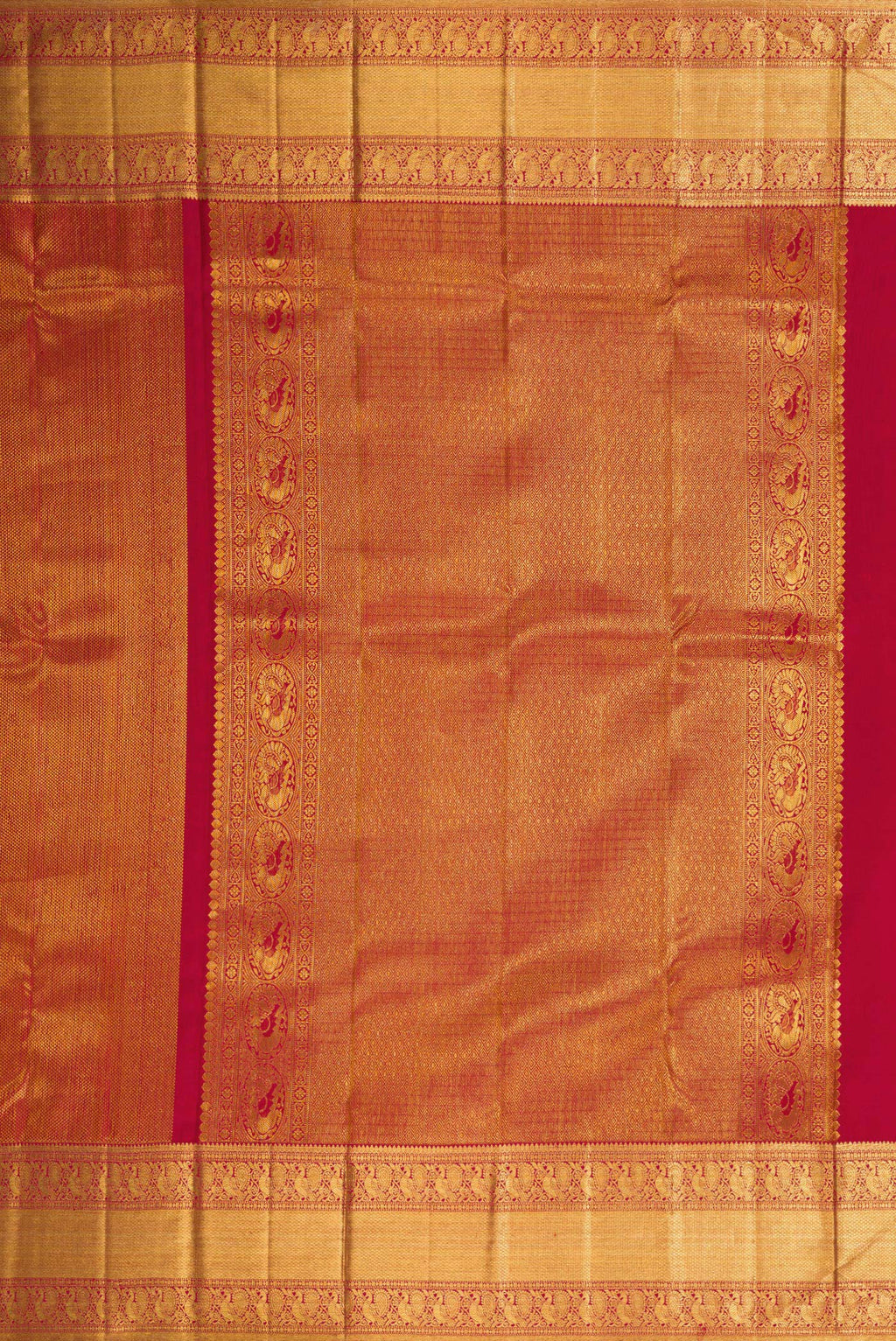 Close up image of the pallu of Maroon Dual Tone Kanchipuram Silk Saree with Zari Brocade on the body and Zari Border. 
