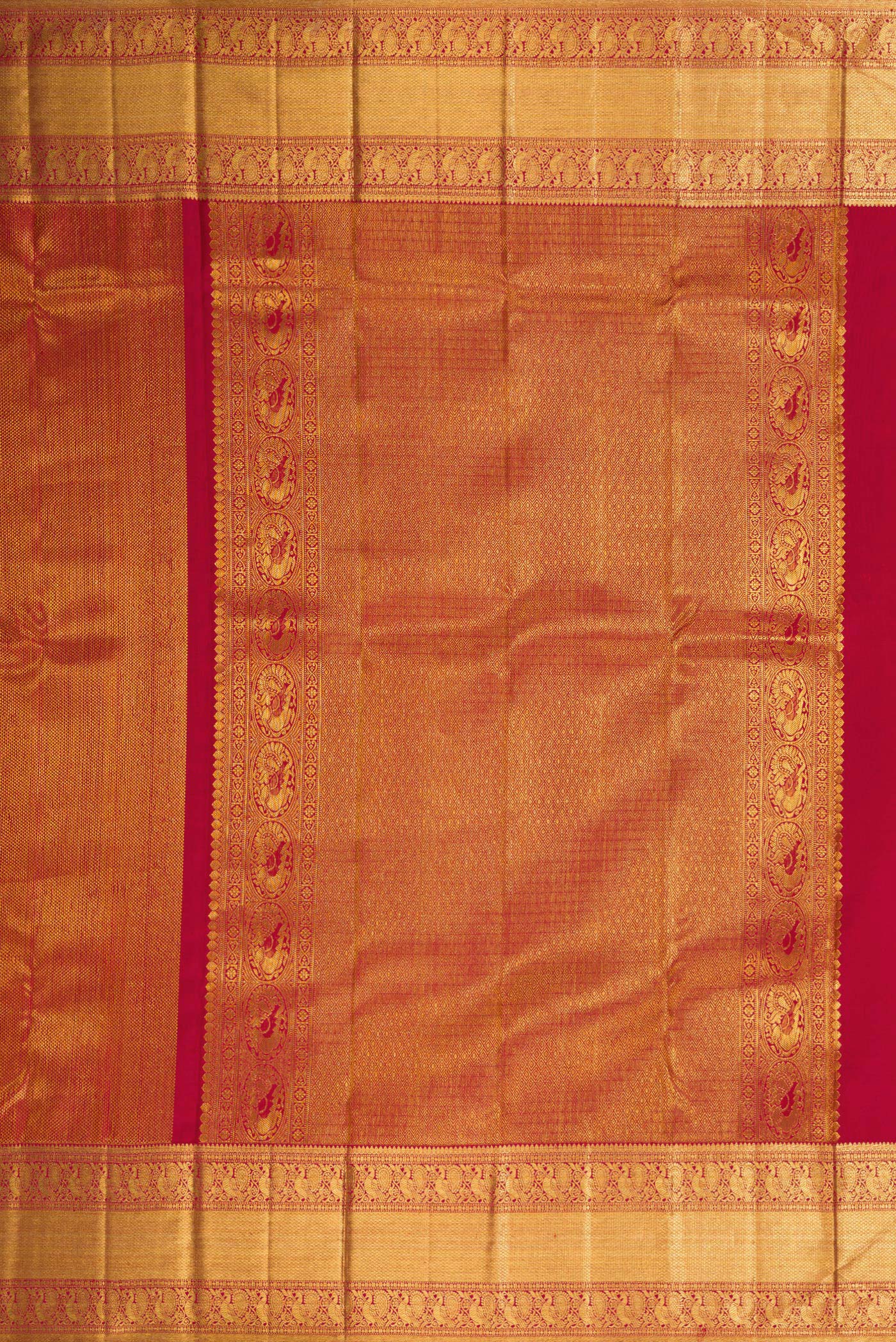 Close up image of the pallu of Maroon Dual Tone Kanchipuram Silk Saree with Zari Brocade on the body and Zari Border. 
