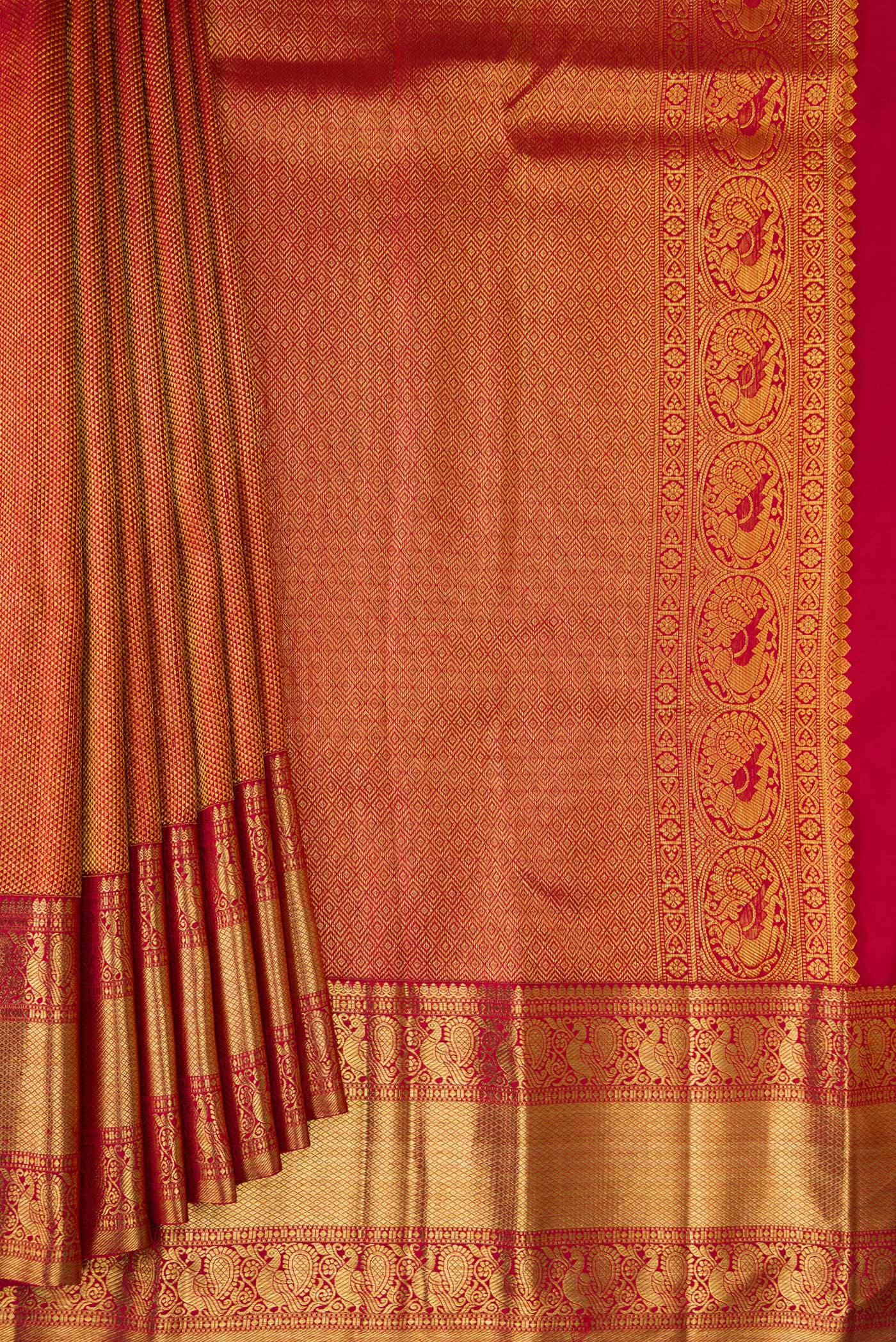 Pleats and pallu of Maroon Dual Tone Kanchipuram Silk Saree with Zari Brocade on the body and Zari Border. 