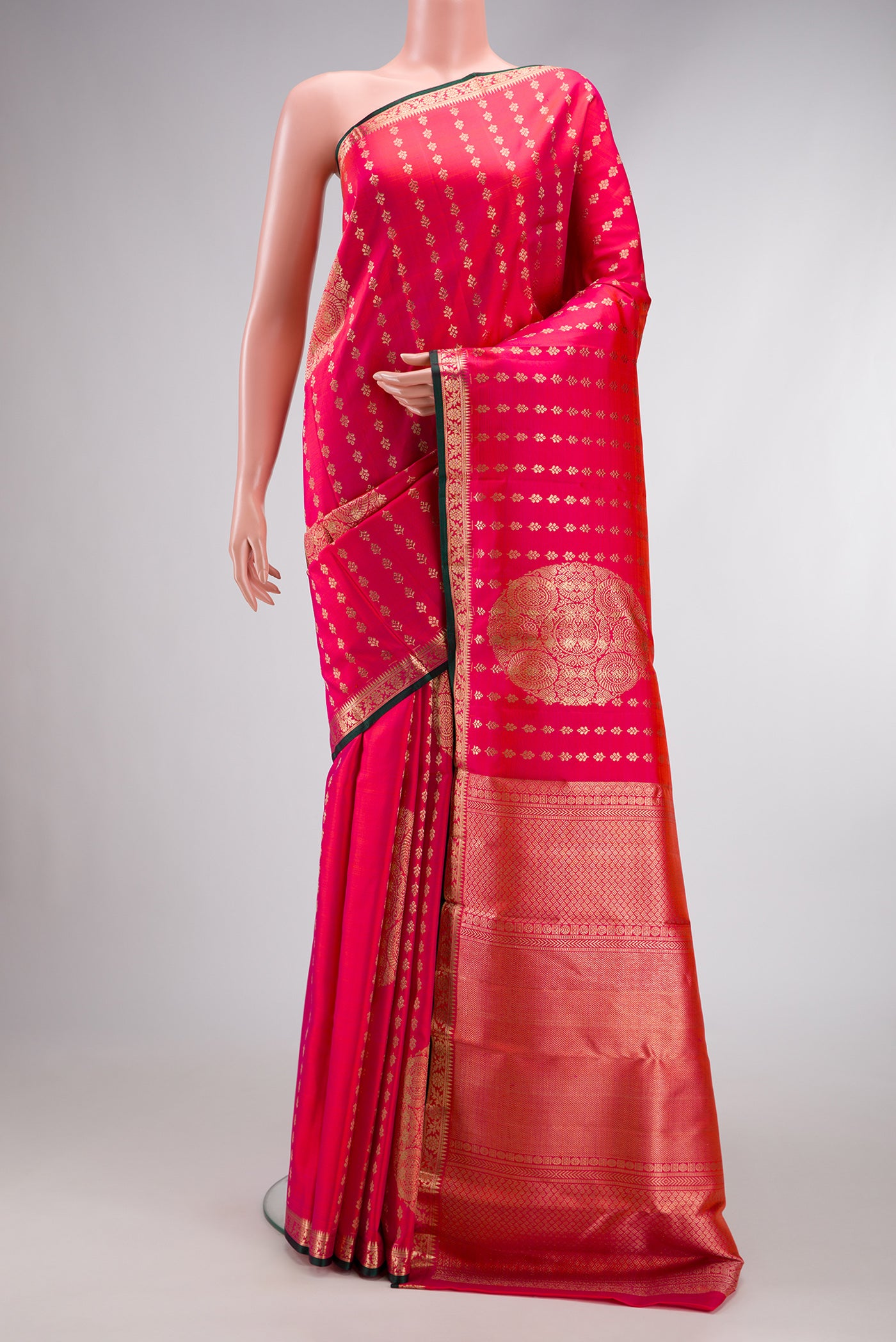 Coral Dual Tone Kanchipuram Silk Saree with Zari Brocade on the body and Zari Border.  displayed on a mannequin