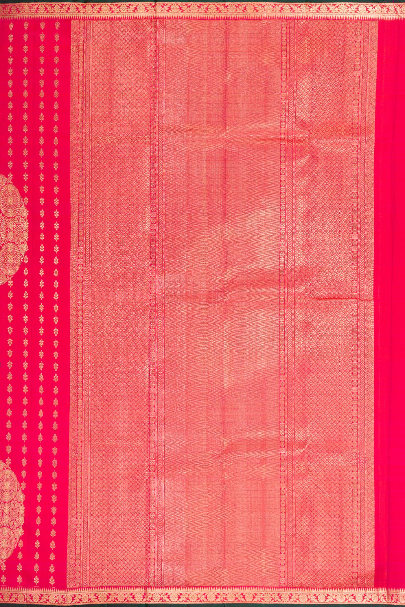 Close up image of the pallu of Coral Dual Tone Kanchipuram Silk Saree with Zari Brocade on the body and Zari Border. 