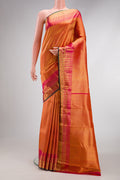 Orange Kanchipuram Silk Saree with Zari Brocade on the body and Zari Border.  displayed on a mannequin
