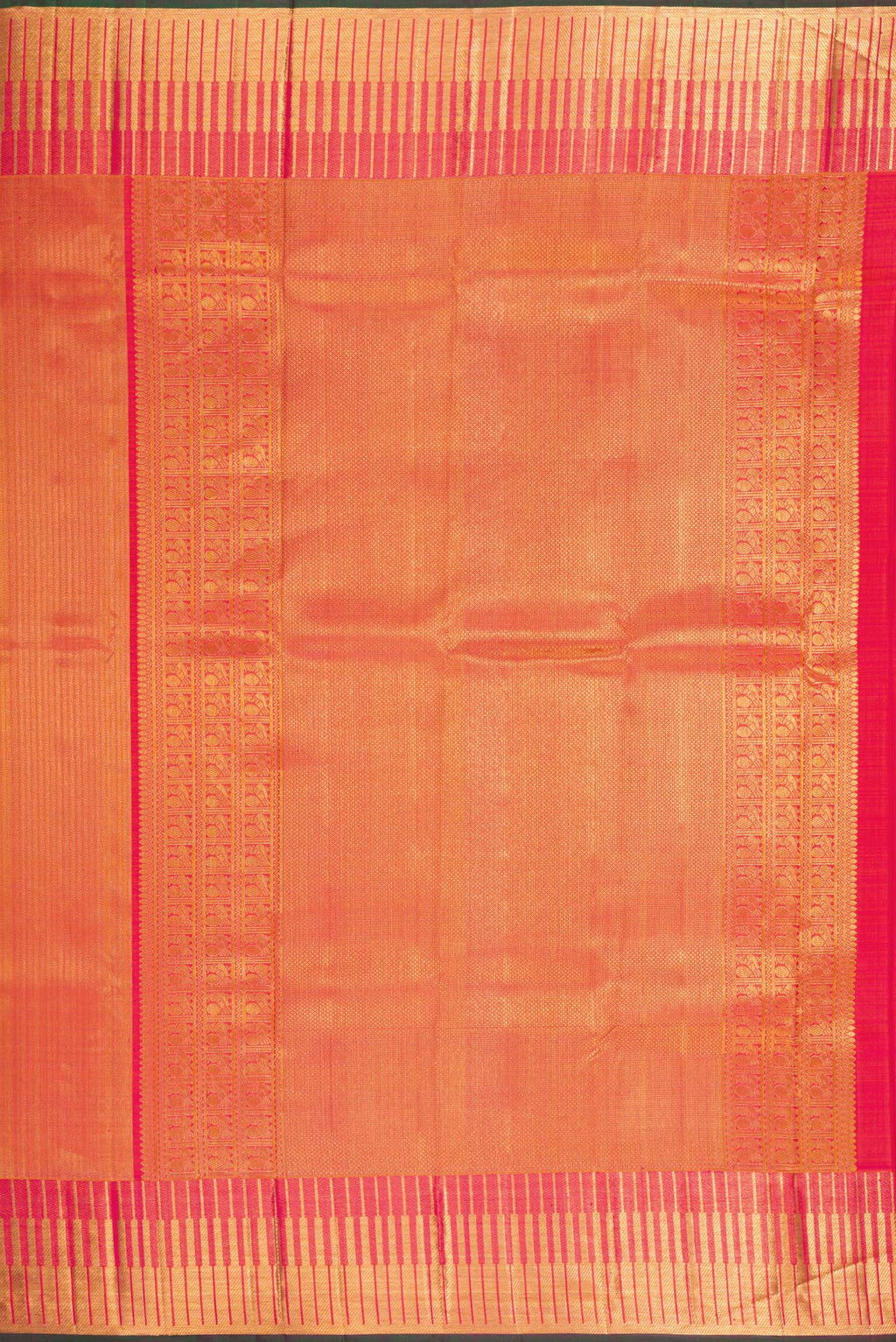 Close up image of the pallu of Orange Kanchipuram Silk Saree with Zari Brocade on the body and Zari Border. 