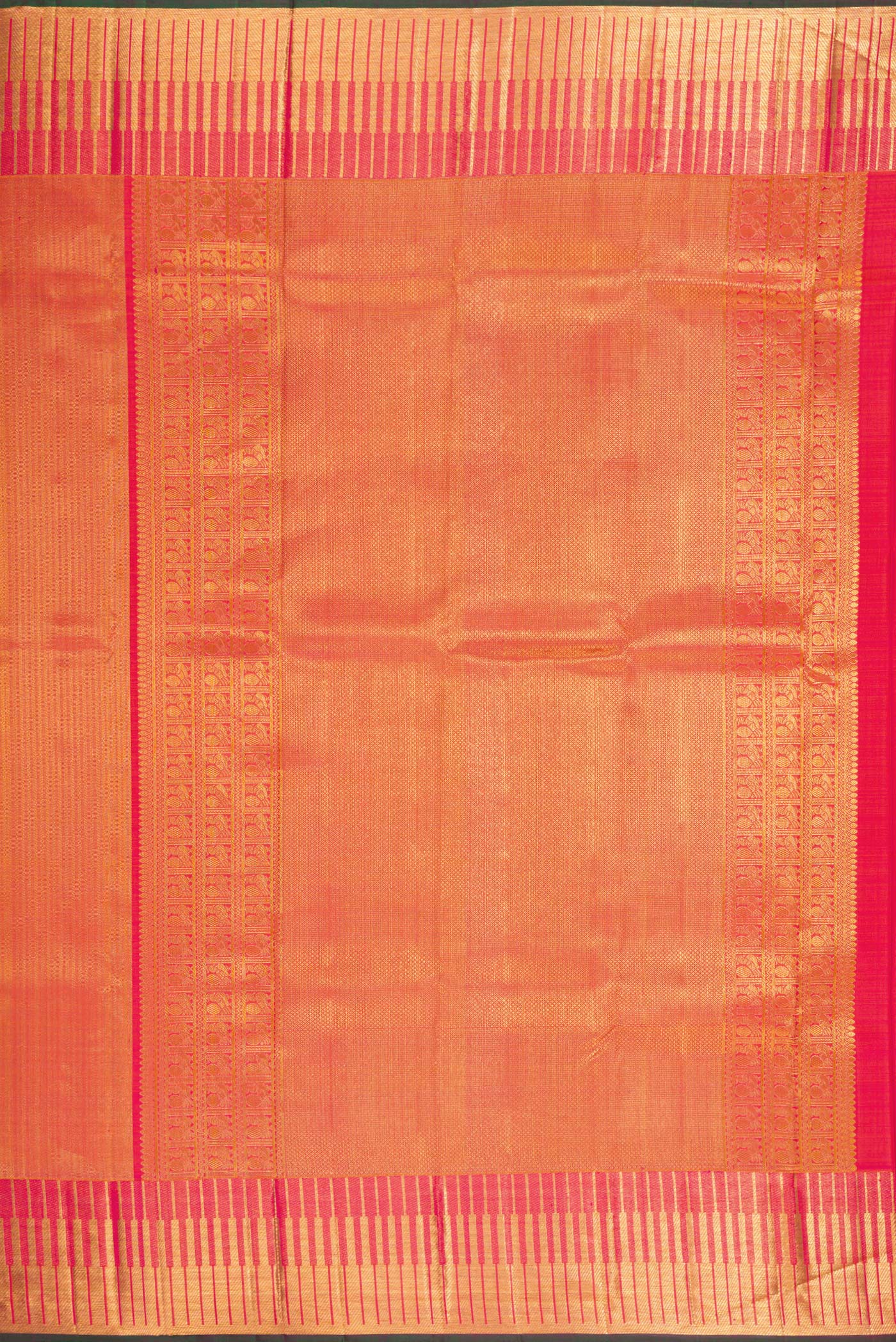 Close up image of the pallu of Orange Kanchipuram Silk Saree with Zari Brocade on the body and Zari Border. 