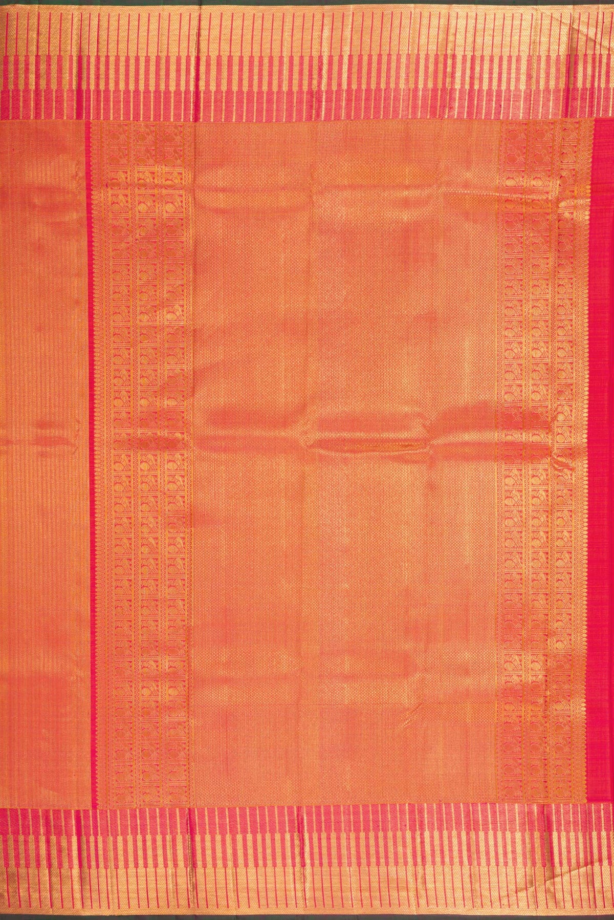 Close up image of the pallu of Orange Kanchipuram Silk Saree with Zari Brocade on the body and Zari Border. 