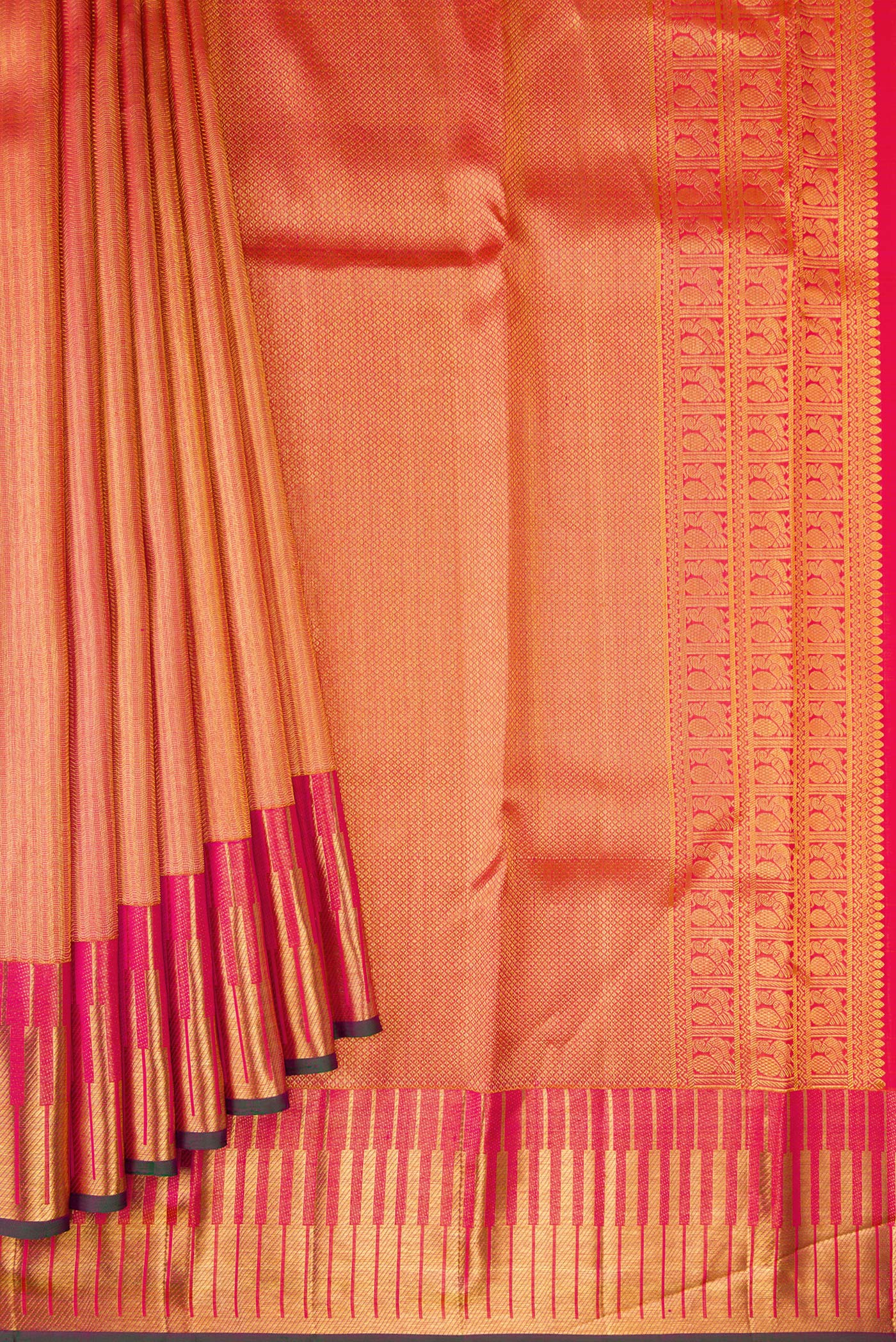 Pleats and pallu of Orange Kanchipuram Silk Saree with Zari Brocade on the body and Zari Border. 