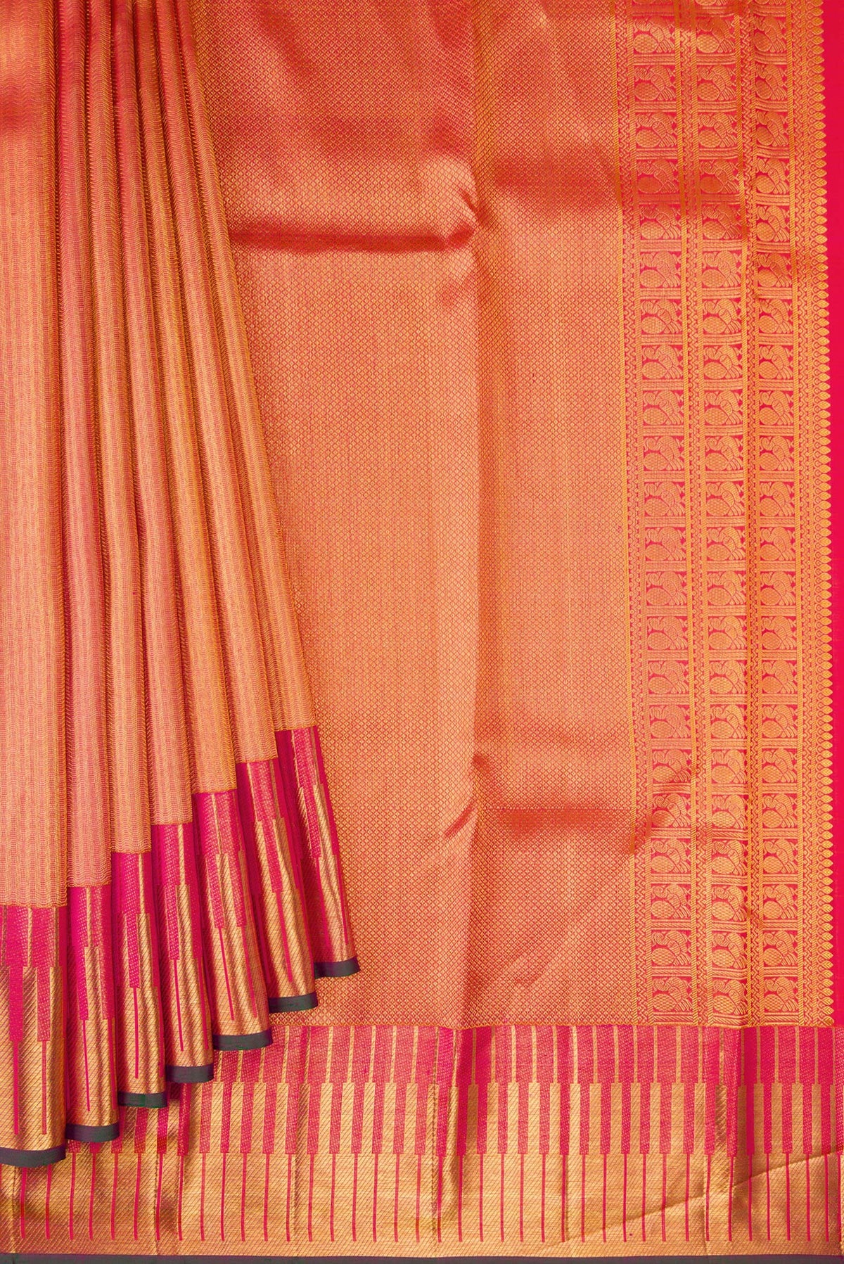 Pleats and pallu of Orange Kanchipuram Silk Saree with Zari Brocade on the body and Zari Border. 