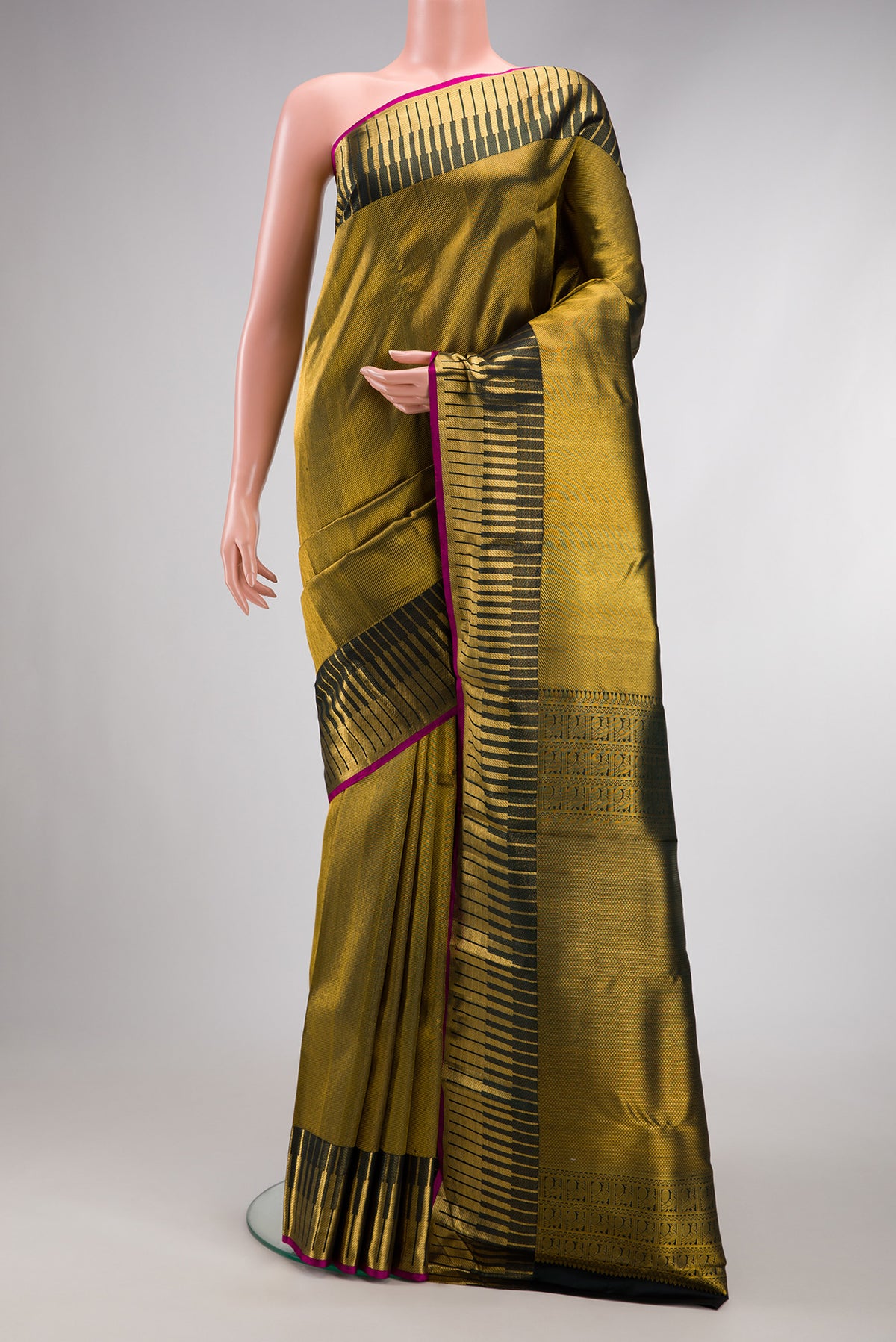 Bottle Green Dual Tone Kanchipuram Silk Saree with Zari Brocade on the body and Fancy Border.  displayed on a mannequin