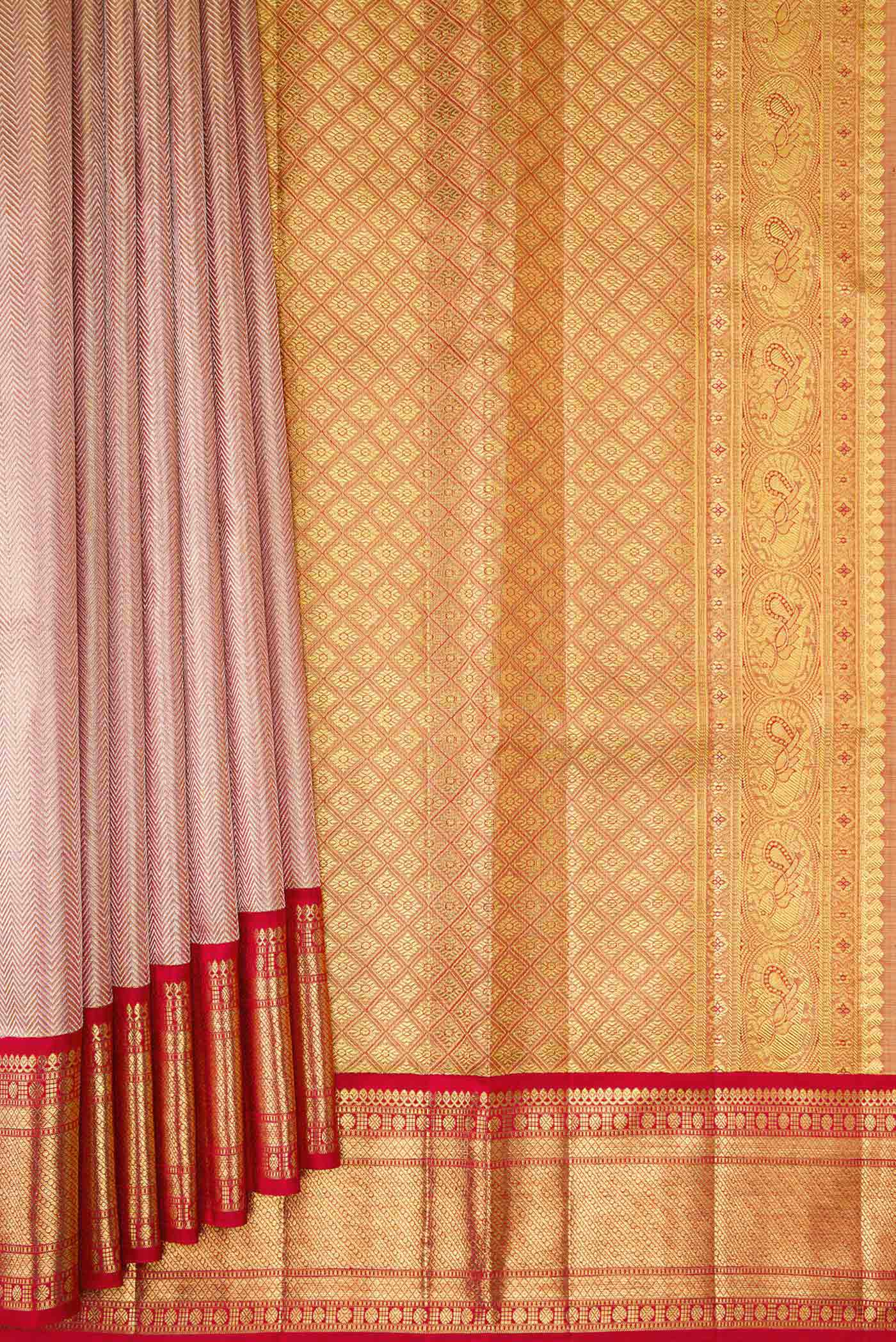 Pleats and pallu of Rose Gold Dual Tone Kanjivaram Tissue Silk Saree with Zari Brocade on the body and Zari Border. 