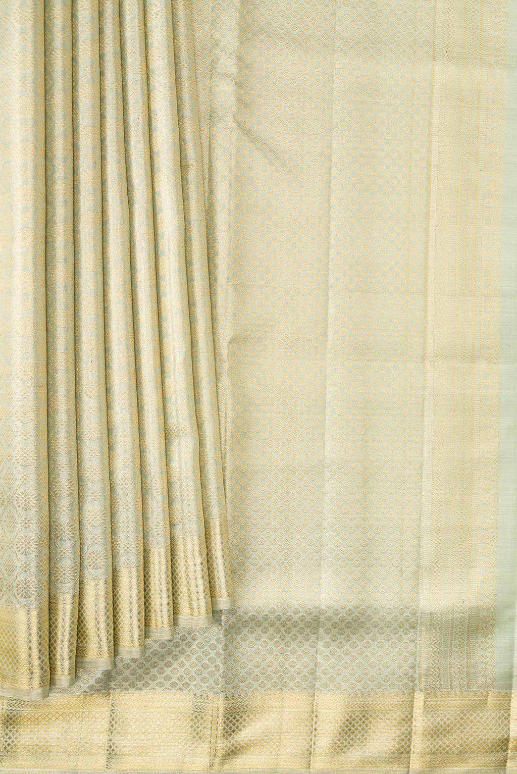 Pleats and pallu of Light Green Dual Tone Kanjivaram Tissue Silk Saree with Zari Brocade on the body and Zari Border. 