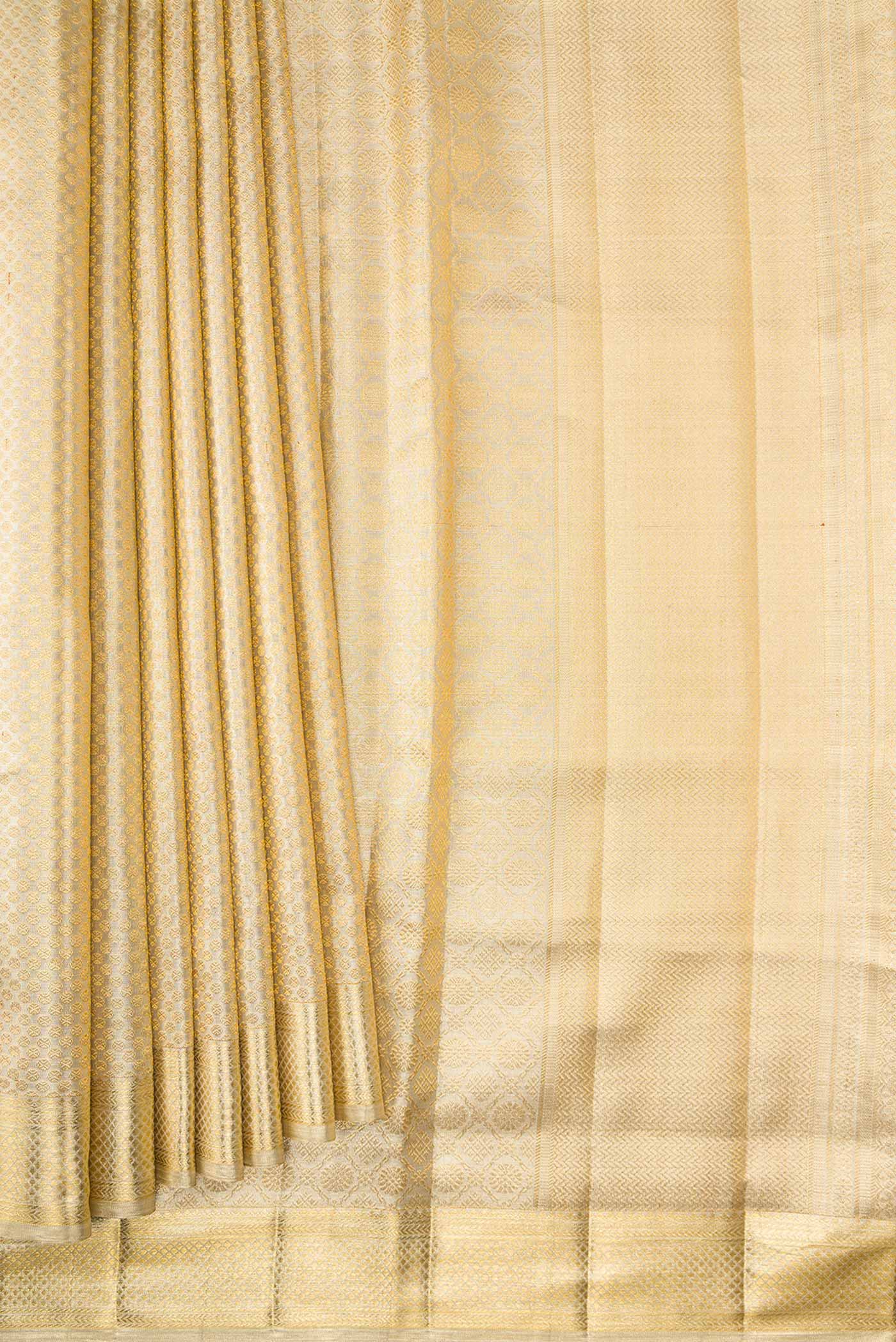 Pleats and pallu of Gold Dual Tone Kanjivaram Tissue Silk Saree with Zari Brocade on the body and Zari Border. 