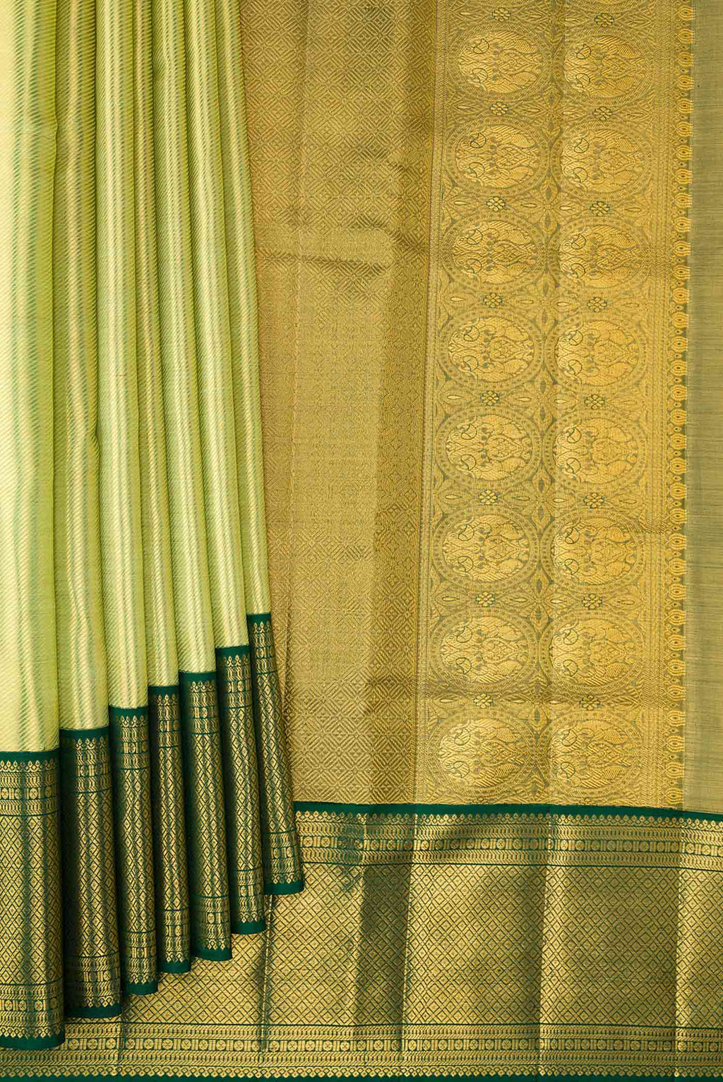 Pleats and pallu of Pista Green Dual Tone Kanjivaram Silk Saree with Zari Brocade on the body and Zari Border. 
