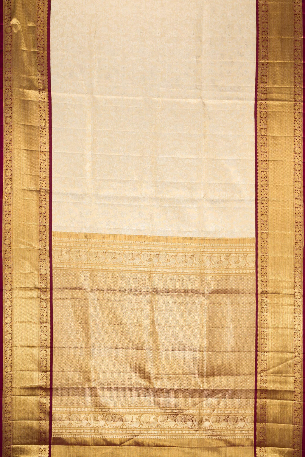 Flat view of Gold Dual Tone Kanjivaram Tissue Silk Saree with Zari Brocade on the body and Zari Border. 