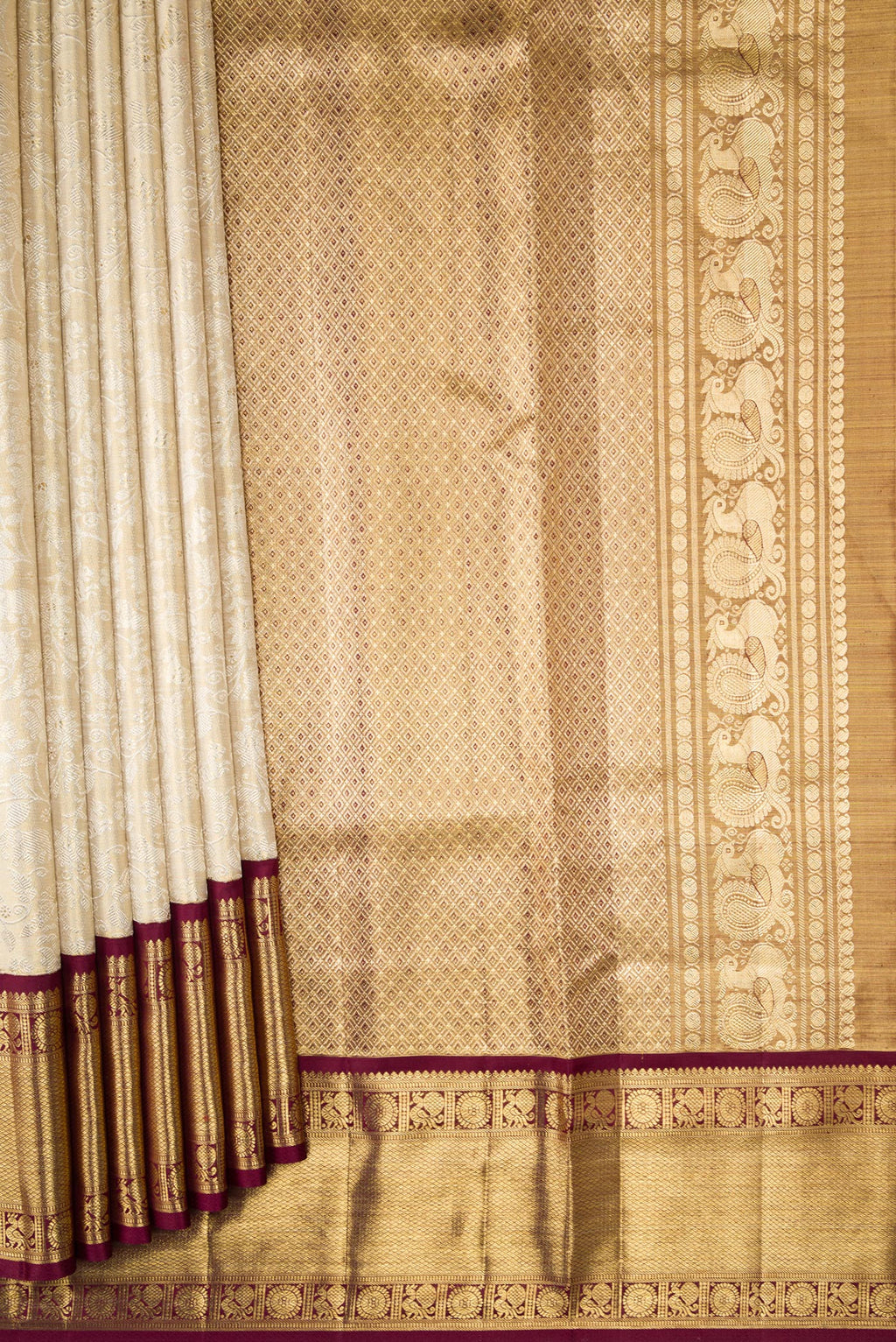 Pleats and pallu of Gold Dual Tone Kanjivaram Tissue Silk Saree with Zari Brocade on the body and Zari Border. 