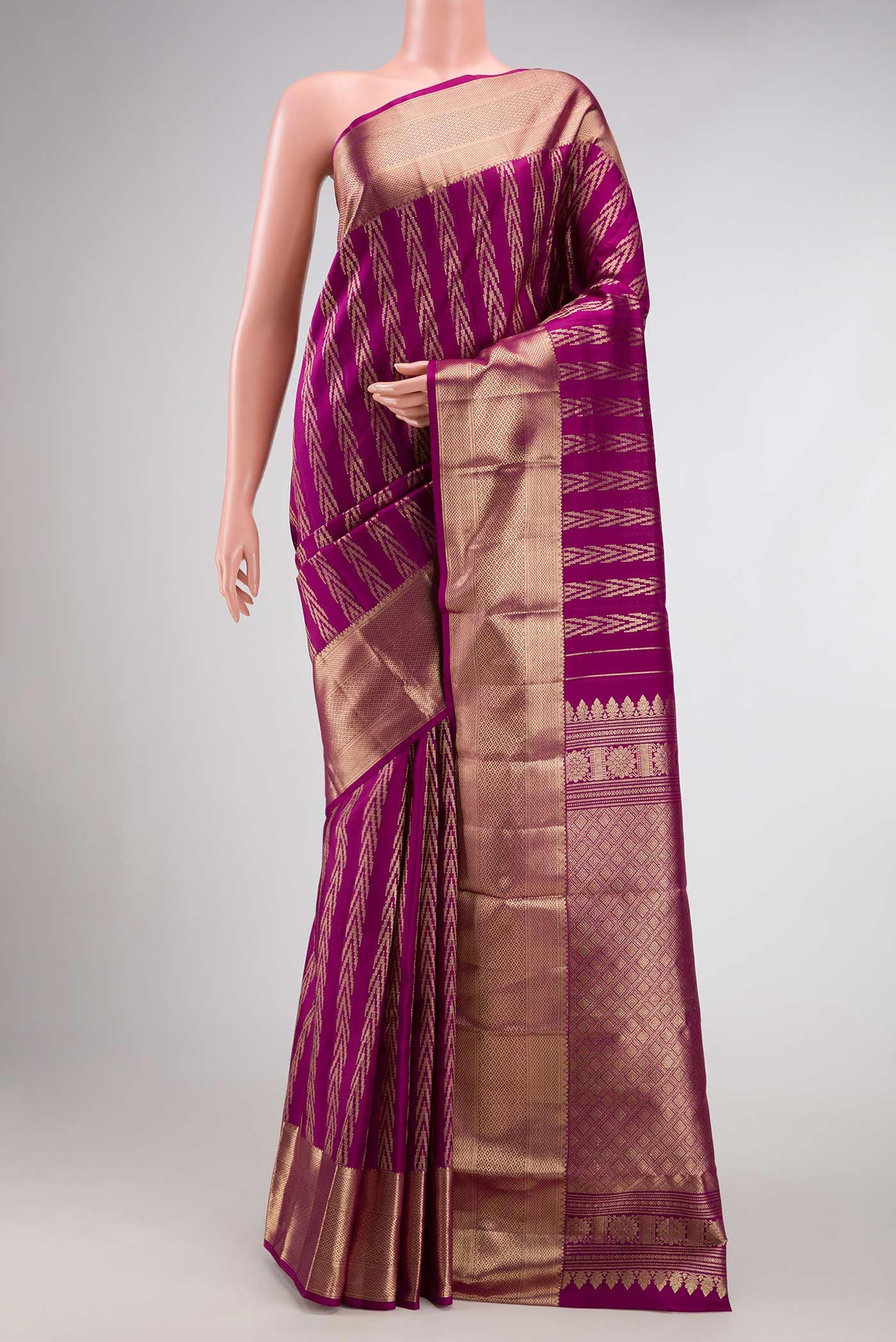 Magenta Dual Tone Kanjivaram Silk Saree with Zari Brocade on the body and Zari Border.  displayed on a mannequin