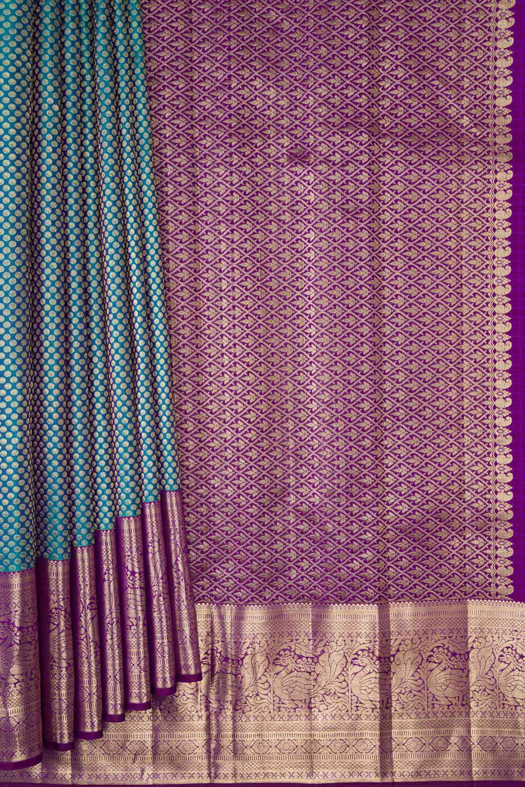 Pleats and pallu of Peacock Blue Dual Tone Kanjivaram Silk Saree with Zari Brocade on the body and Zari Border. 