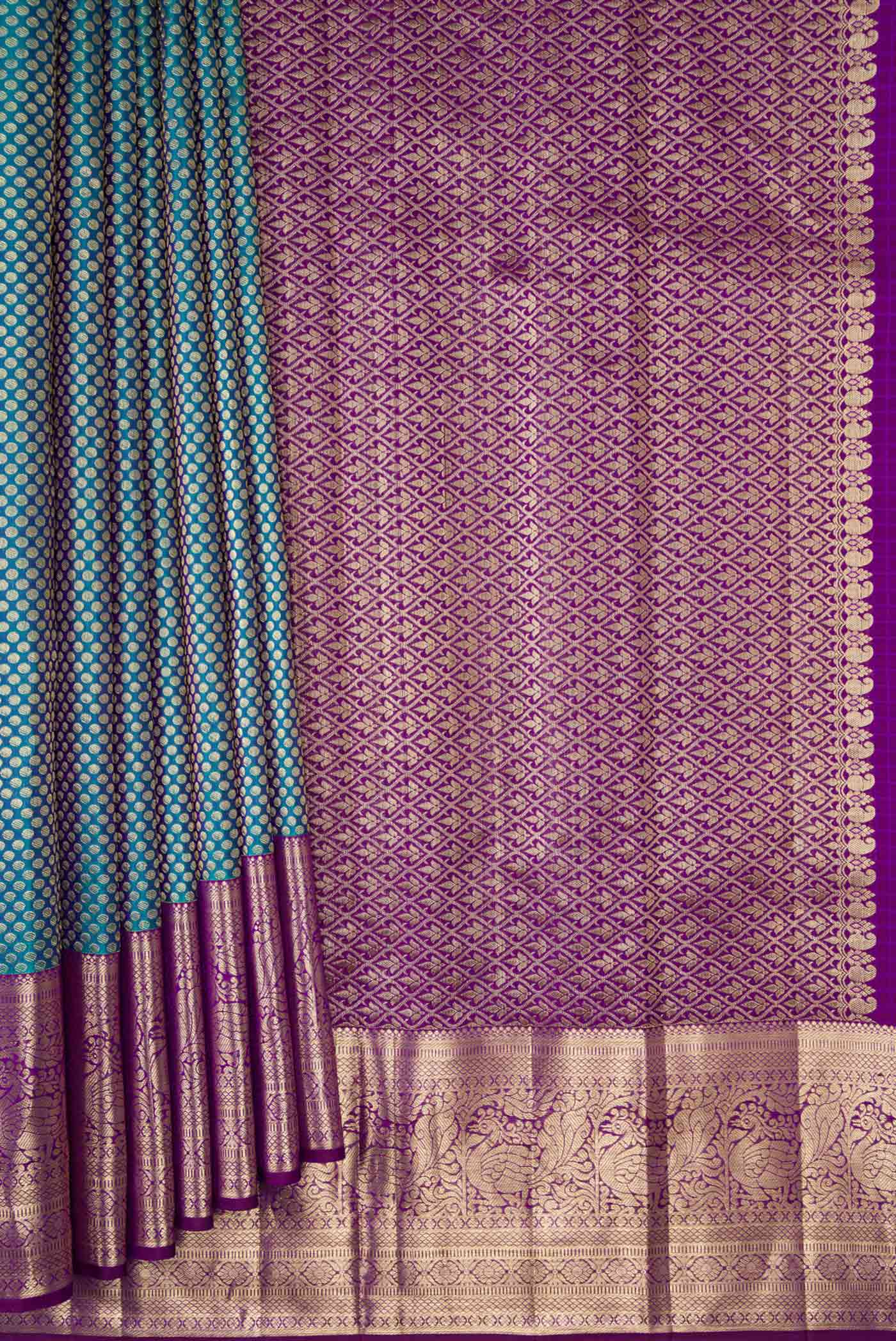 Pleats and pallu of Peacock Blue Dual Tone Kanjivaram Silk Saree with Zari Brocade on the body and Zari Border. 