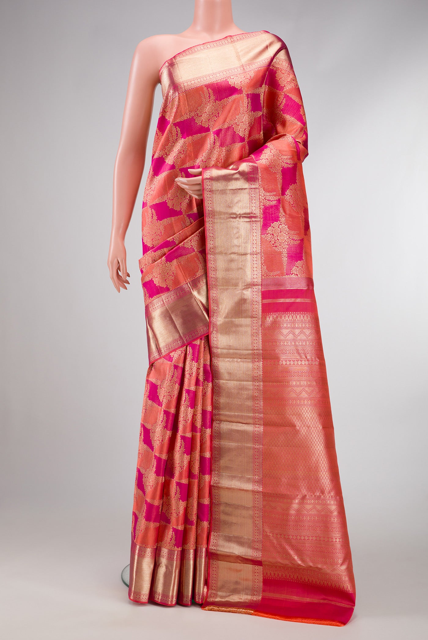 Pink Dual Tone Kanjivaram Silk Saree with Zari Brocade on the body and Zari Border.  displayed on a mannequin