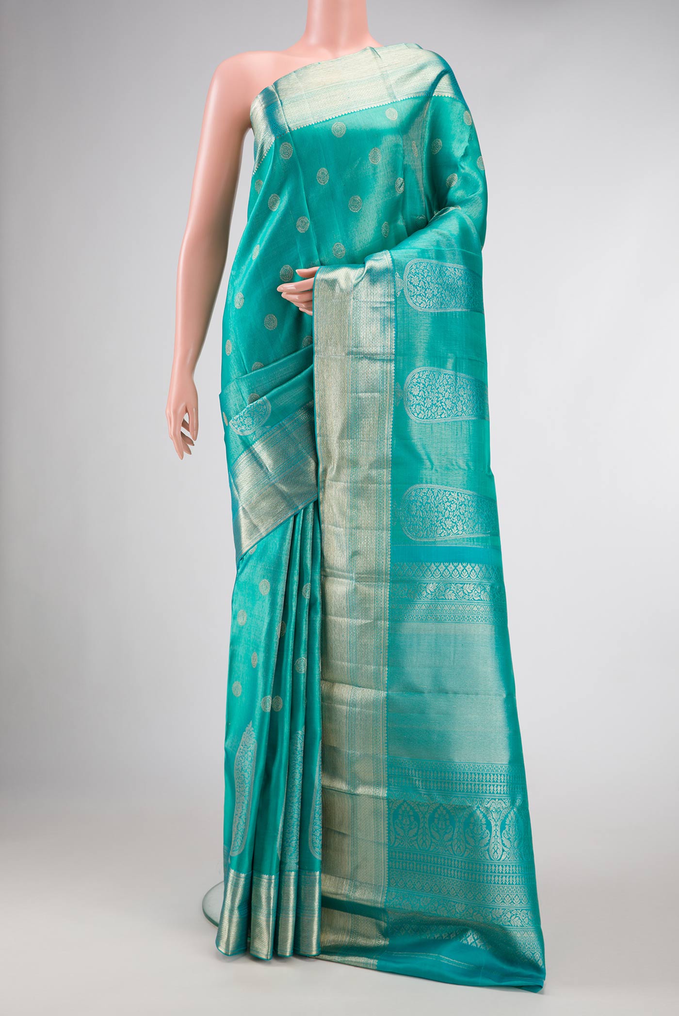 Peacock Blue Dual Tone Kanjivaram Silk Saree with Zari Brocade on the body and Zari Border.  displayed on a mannequin
