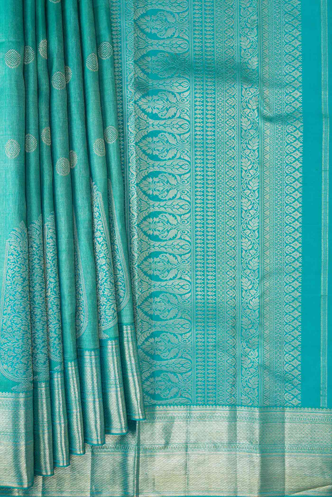 Pleats and pallu of Peacock Blue Dual Tone Kanjivaram Silk Saree with Zari Brocade on the body and Zari Border. 