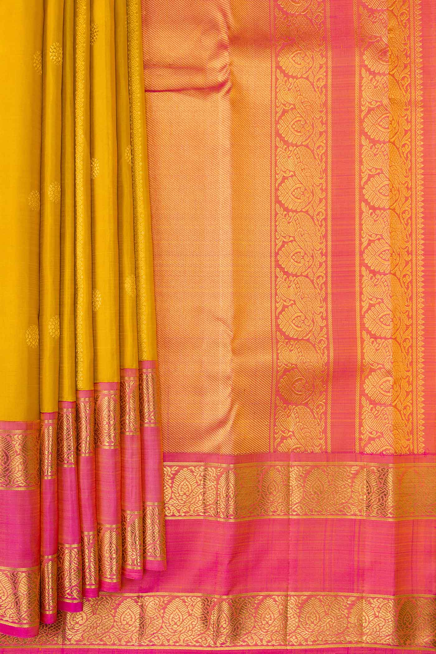 Pleats and pallu of Mustard Dual Tone Kanchipuram Silk Saree with Stripes on the body and Zari Border. 