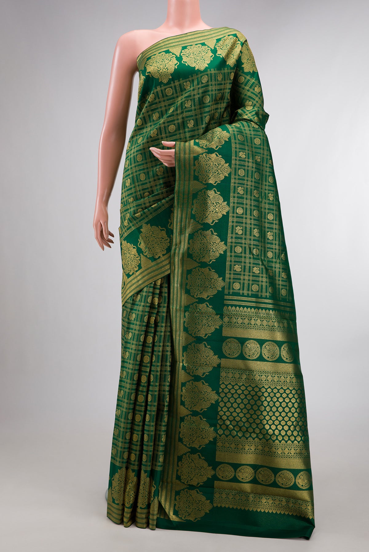 Pure Silk Bottle Green Kanchipuram Saree with Zari Brocade on the body and Fancy Border.  displayed on a mannequin