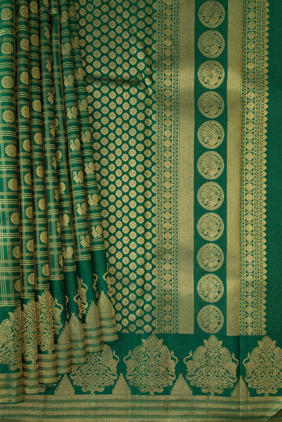 Pleats and pallu of Pure Silk Bottle Green Kanchipuram Saree with Zari Brocade on the body and Fancy Border. 