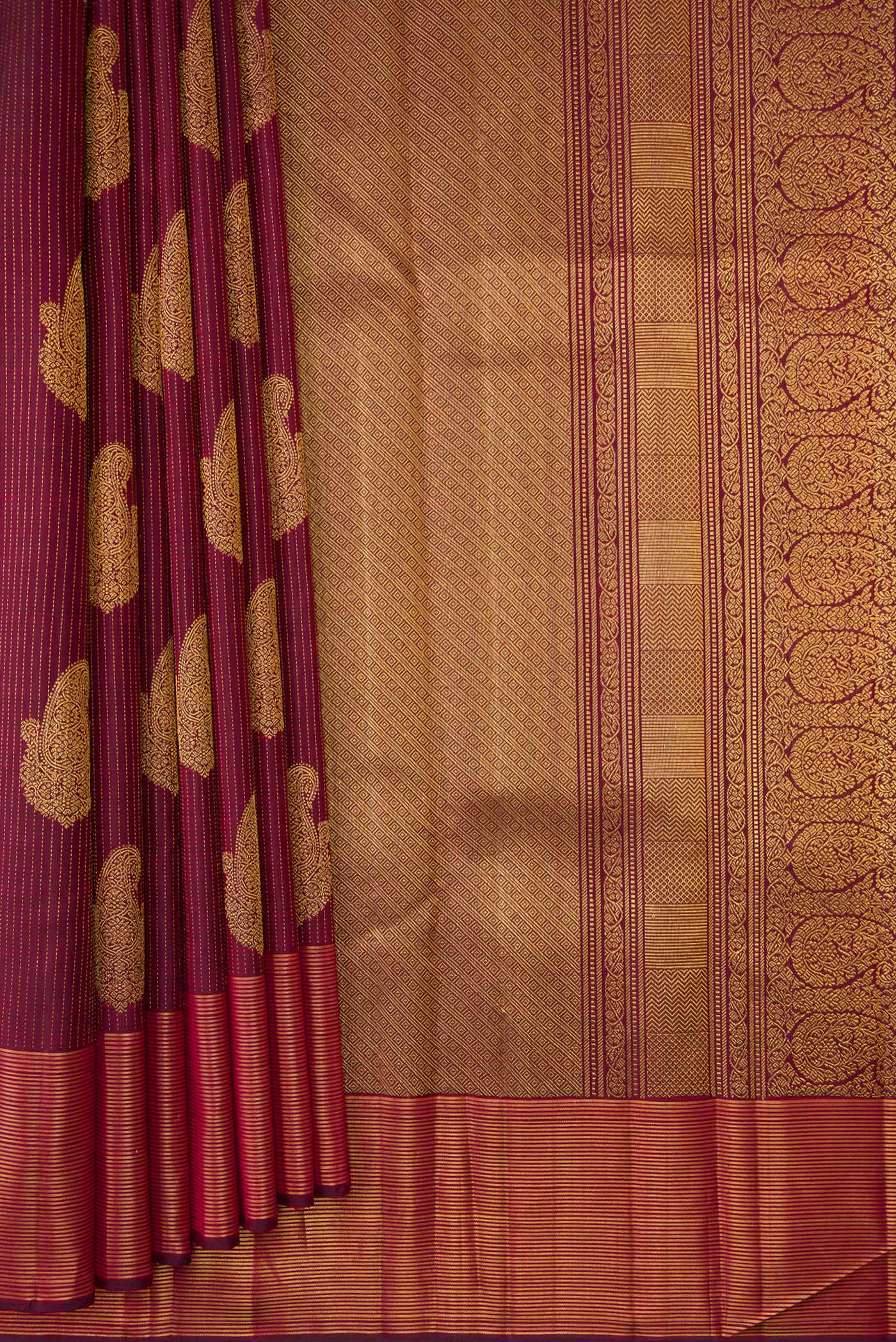 Pleats and pallu of Pure Silk Pure Zari Maroon Dual Tone Kanjivaram Saree with Stripes on the body and Zari Border. 