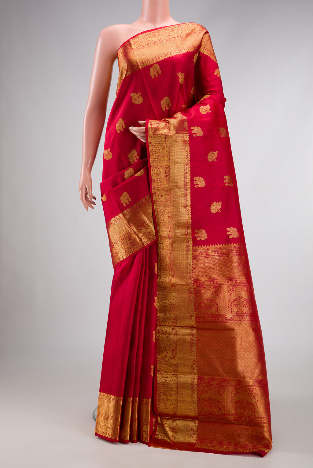 Pure Silk Pure Zari Red Dual Tone Kanjivaram Saree with Zari Butta on the body and Zari Border.  displayed on a mannequin