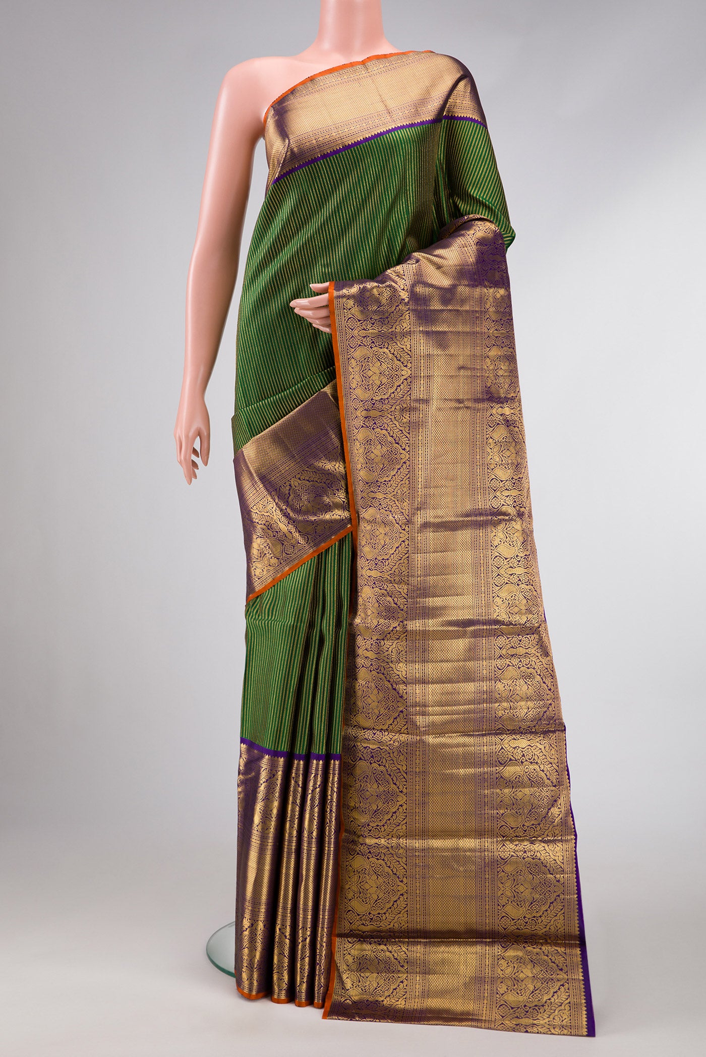Pure Silk Pure Zari Bottle Green Dual Tone Kanchipuram Saree with Stripes on the body and Zari Border.  displayed on a mannequin