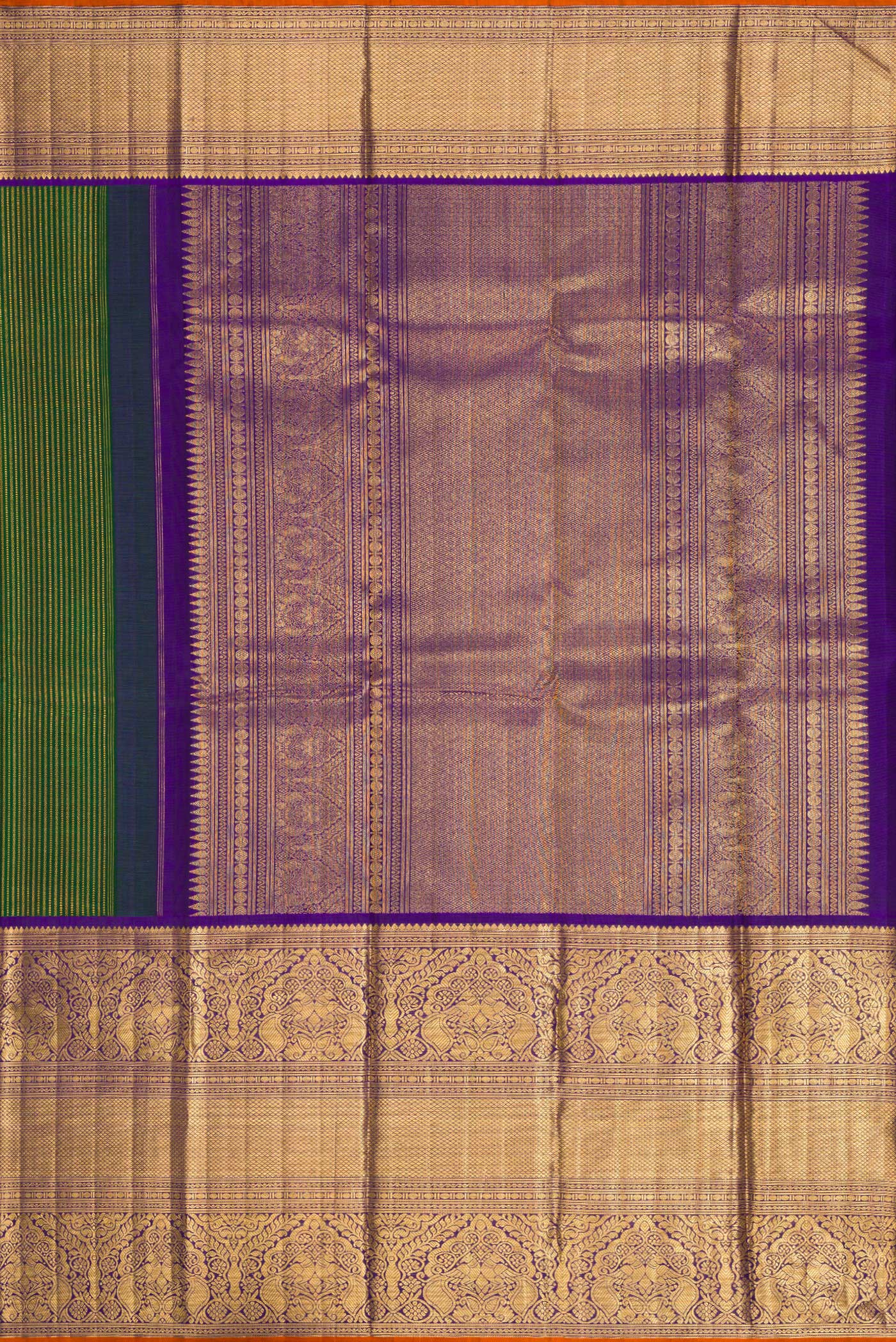 Close up image of the pallu of Pure Silk Pure Zari Bottle Green Dual Tone Kanchipuram Saree with Stripes on the body and Zari Border. 