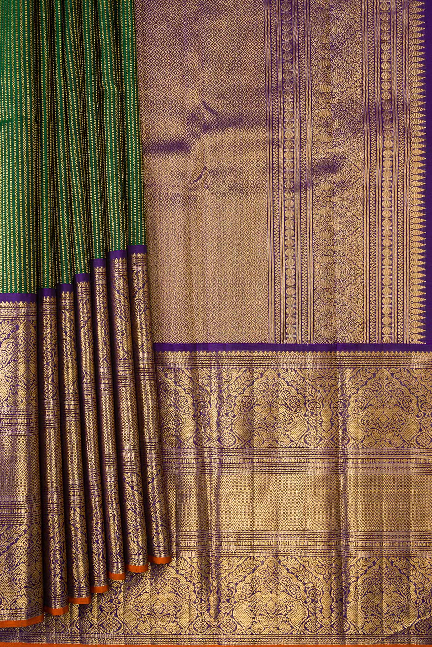 Pleats and pallu of Pure Silk Pure Zari Bottle Green Dual Tone Kanchipuram Saree with Stripes on the body and Zari Border. 