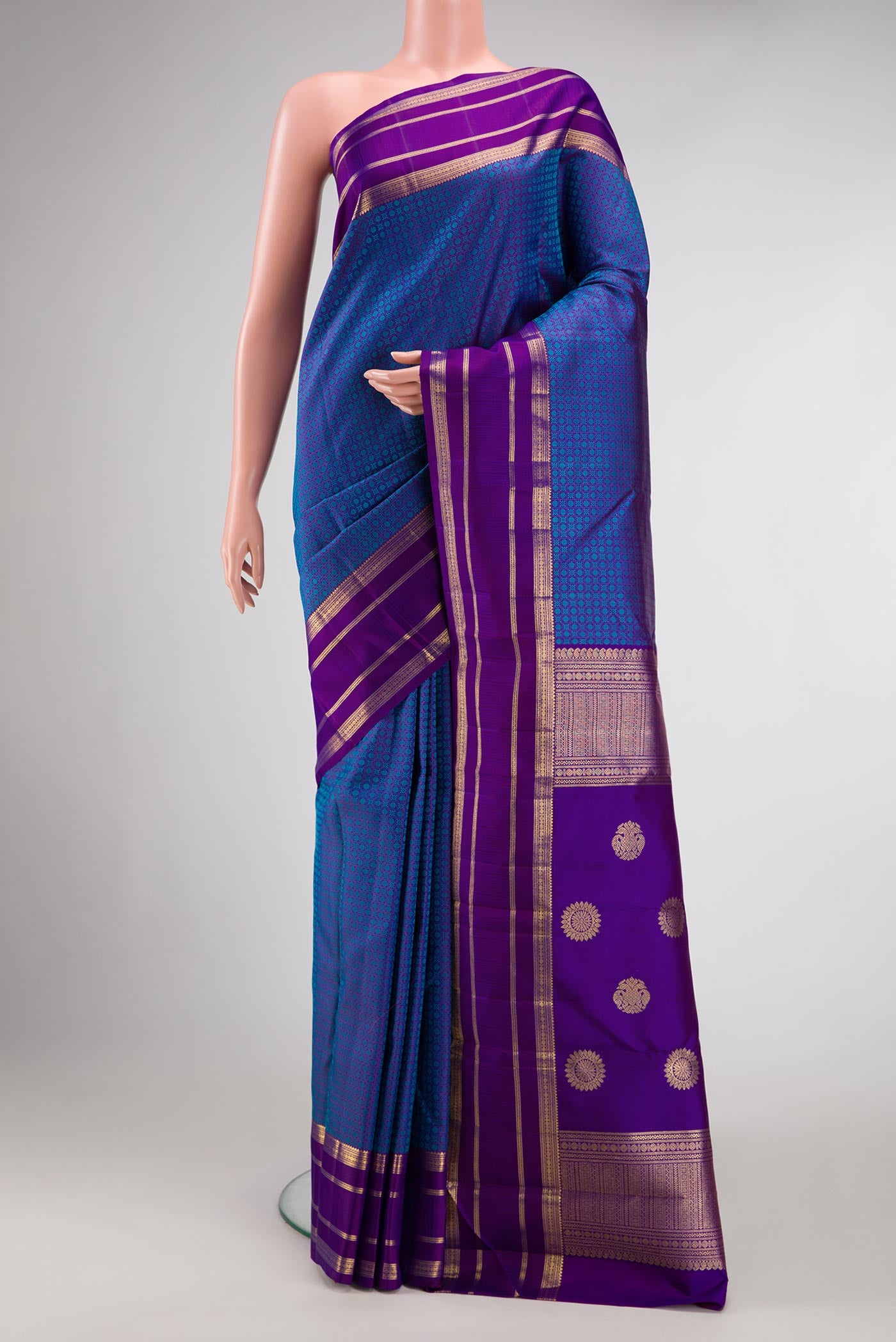 Pure Silk Pure Zari Royal Blue Dual Tone Kanjivaram Saree with Jacquard With Zari Butta on the body and Zari Border.  displayed on a mannequin