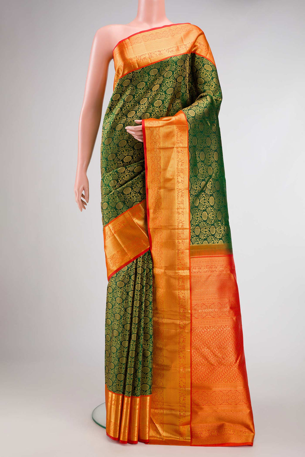Bottle Green Dual Tone Kanchipuram Silk Saree with Zari Brocade on the body and Zari Border.  displayed on a mannequin