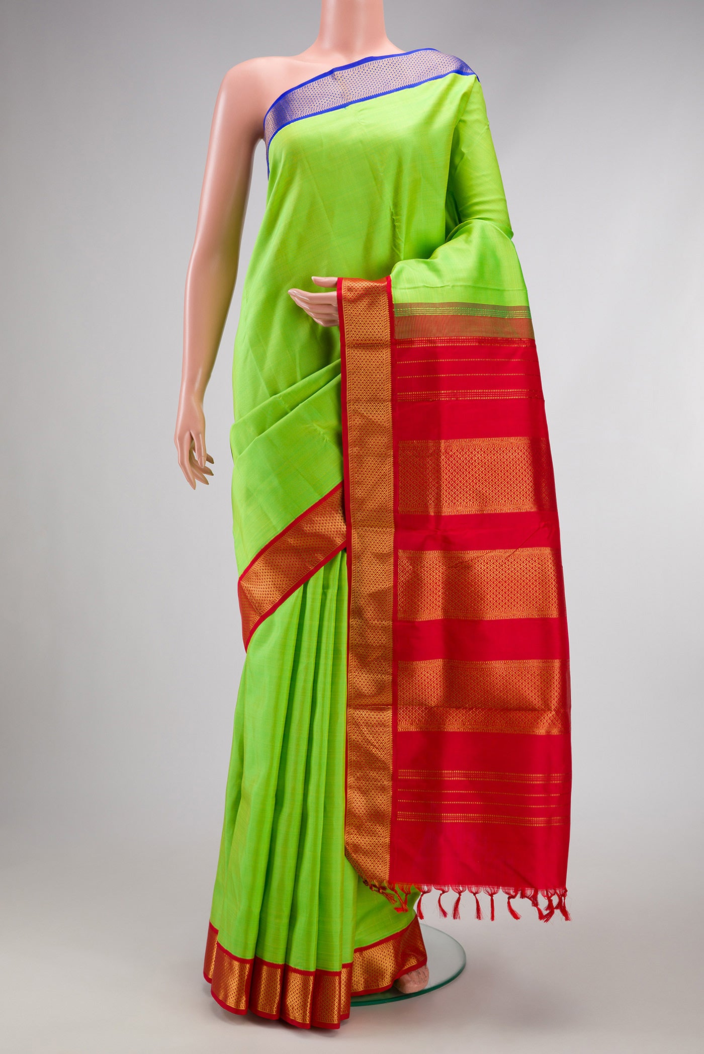 Pure Silk Pure Zari Parrot Green Kanchipuram Nine Yards Saree with Plain Body and Ganga Jamuna Border.  displayed on a mannequin