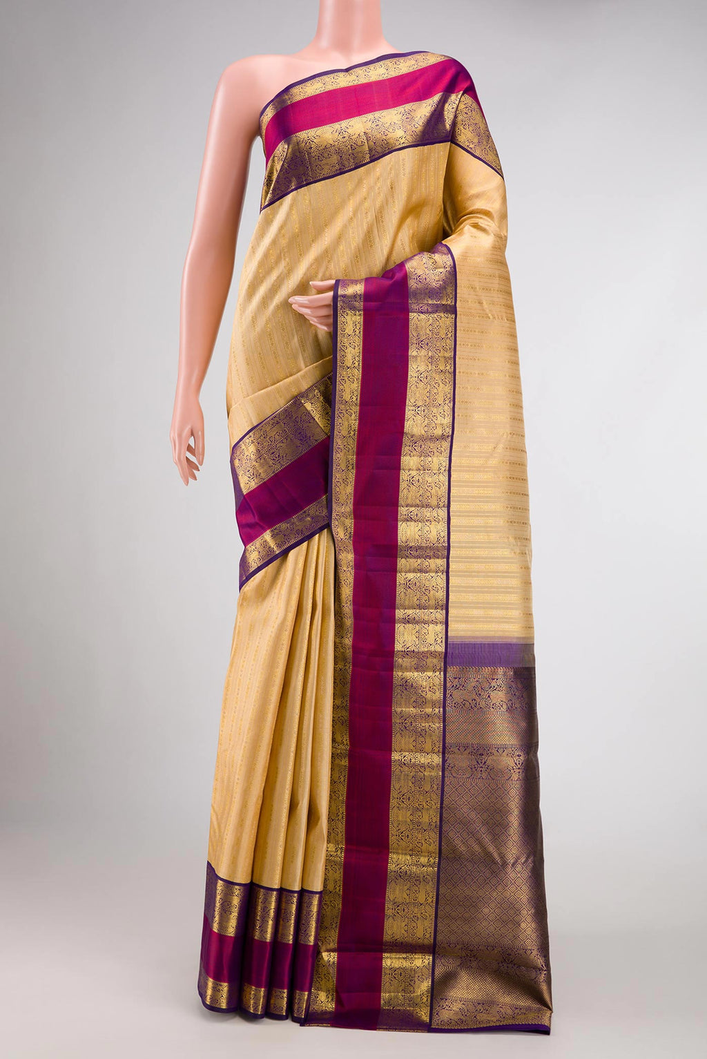 Sandal Dual Tone Kanchipuram Silk Saree with Zari Brocade on the body and Zari And Thread Border.  displayed on a mannequin