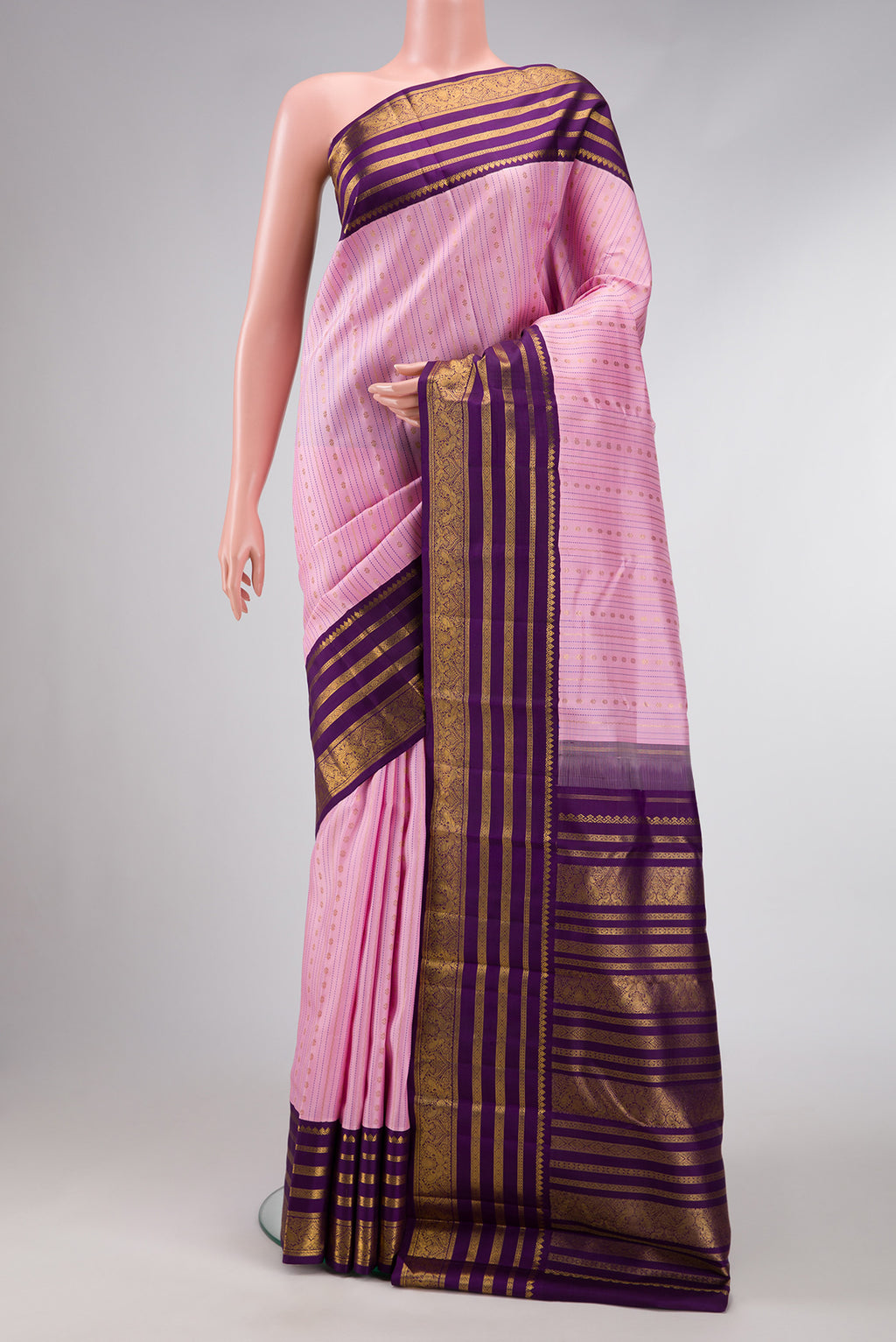 Pure Silk Pure Zari Pink Dual Tone Kanchipuram Saree with Stripes on the body and Zari Border.  displayed on a mannequin