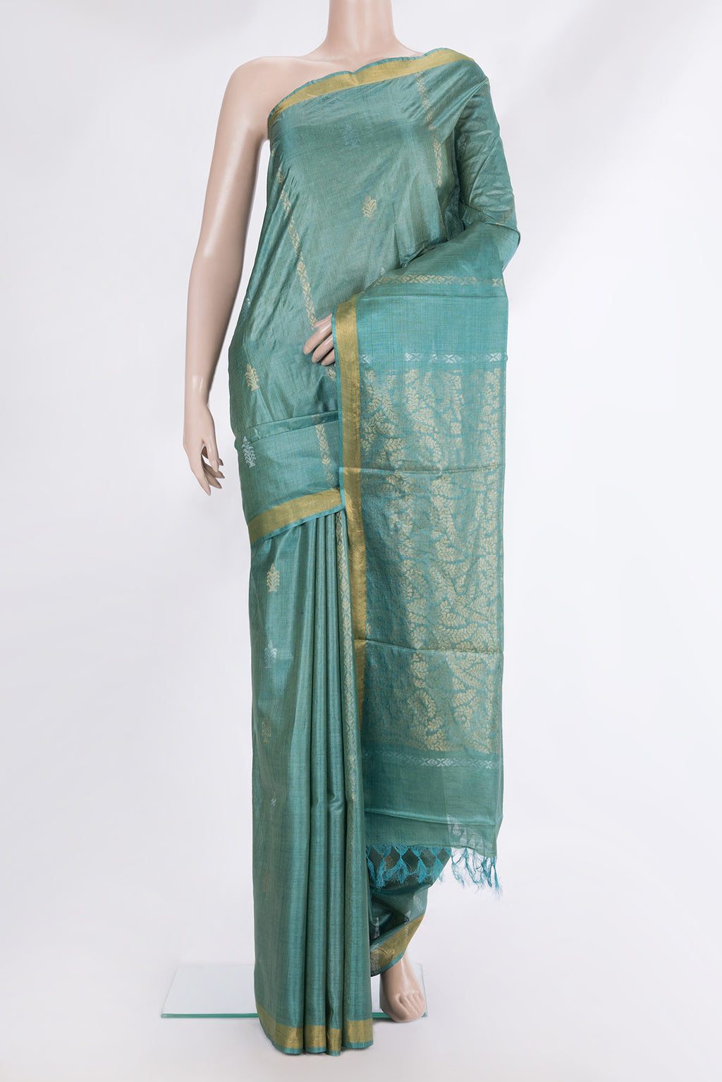 Pure Silk Green Dual Tone Tussar Saree with Zari Butta on the body and Zari Border.  displayed on a mannequin