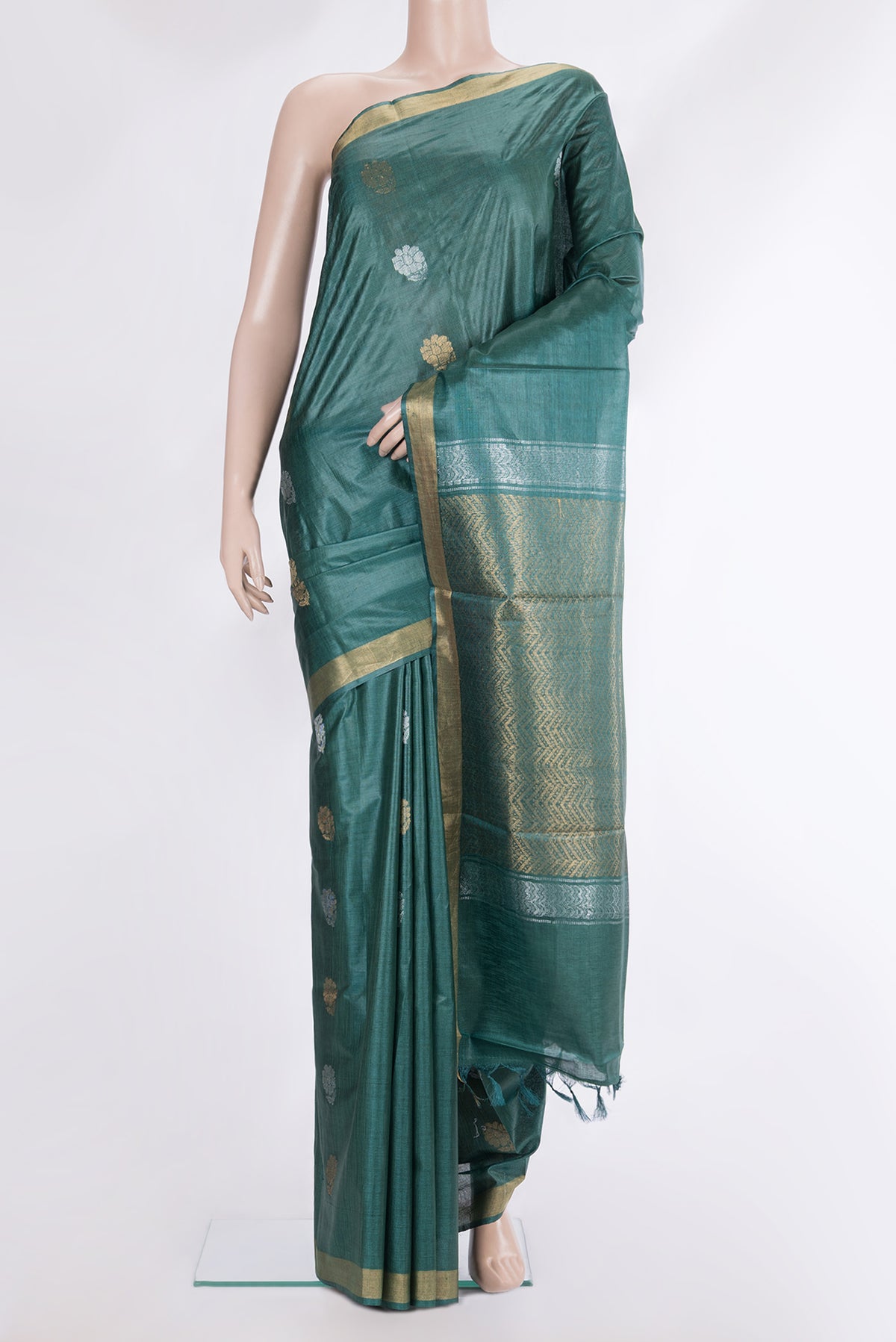 Pure Silk Green Dual Tone Tussar Saree with Zari Butta on the body and Zari Border.  displayed on a mannequin