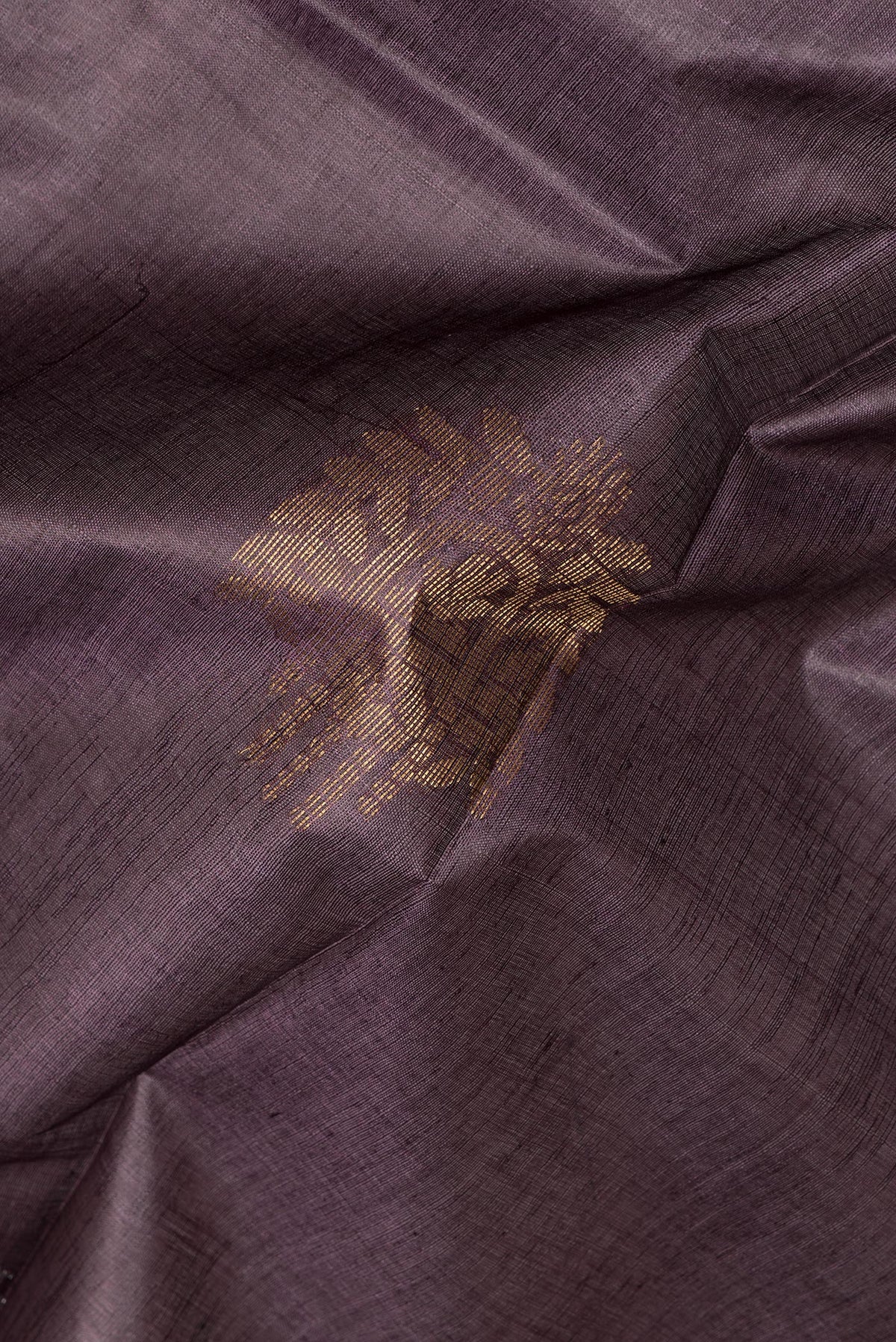 Close up of Pure Silk Purple Dual Tone Tussar Saree with Zari Butta on the body and Zari Border.  displaying folds