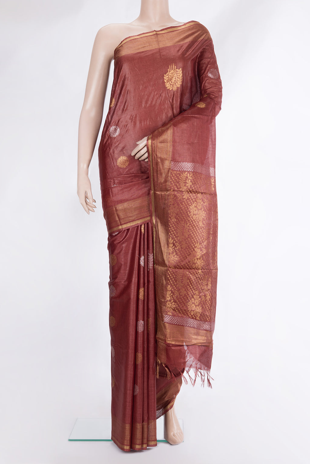 Pure Silk Rust Dual Tone Tussar Saree with Zari Butta on the body and Zari Border.  displayed on a mannequin