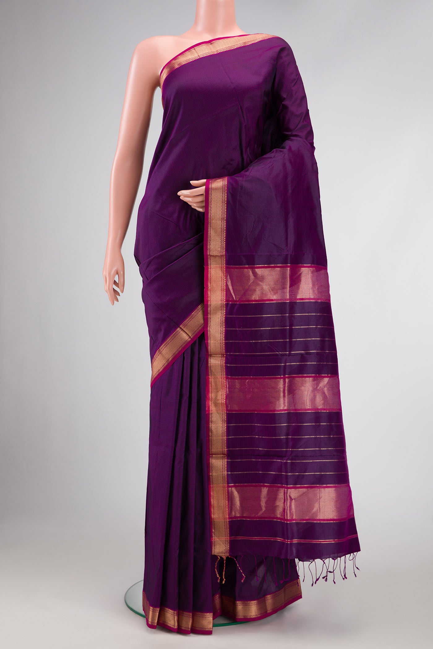 Burgundy Dual Tone Maheshwari Silk Saree with Stripes on the body and Zari Border.  displayed on a mannequin