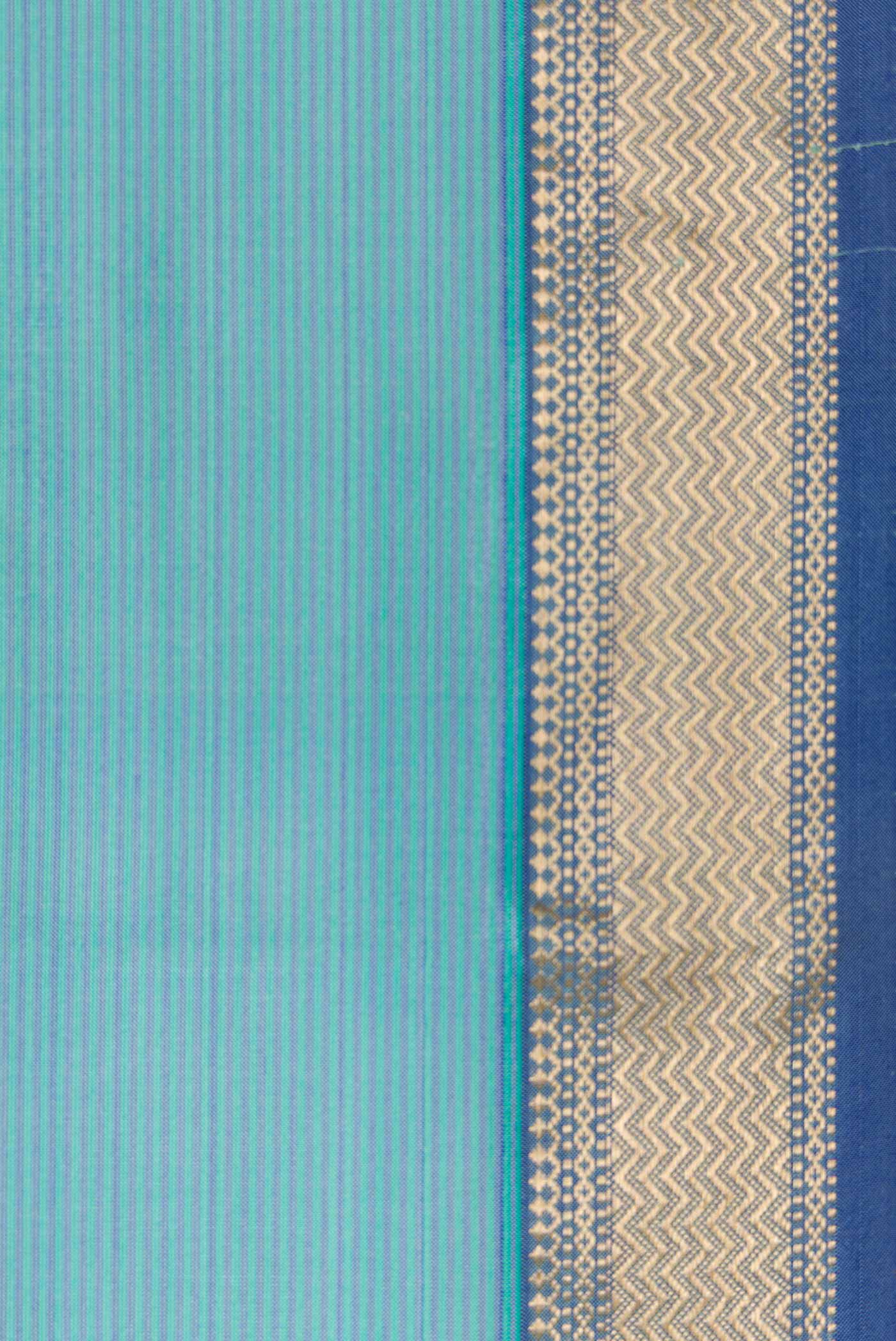 Border image of Maya Blue Dual Tone Maheshwari Silk Saree with Stripes on the body and Zari Border. 
