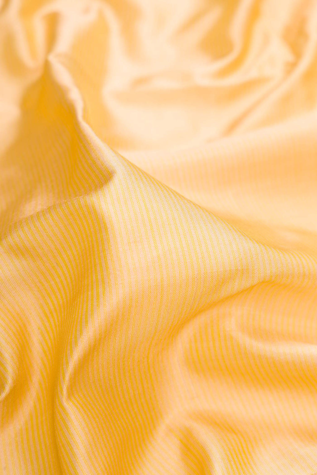 Close up of Sandal Dual Tone Maheshwari Silk Saree with Stripes on the body and Zari Border.  displaying folds