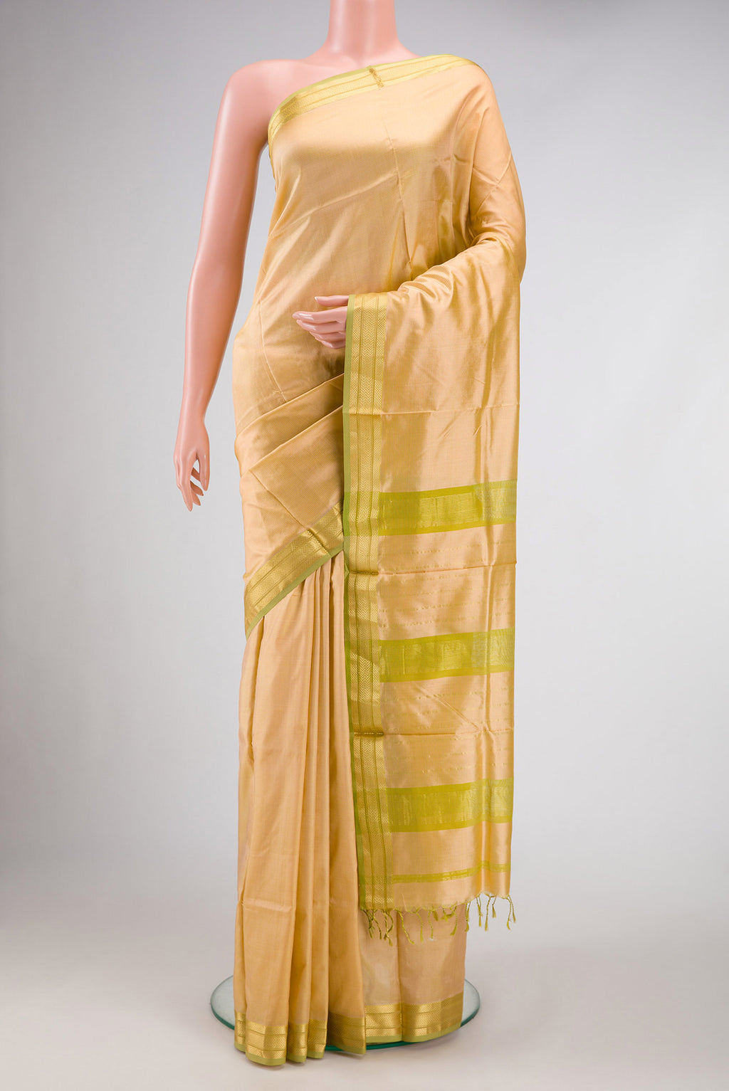 Sandal Dual Tone Maheshwari Silk Saree with Stripes on the body and Zari Border.  displayed on a mannequin
