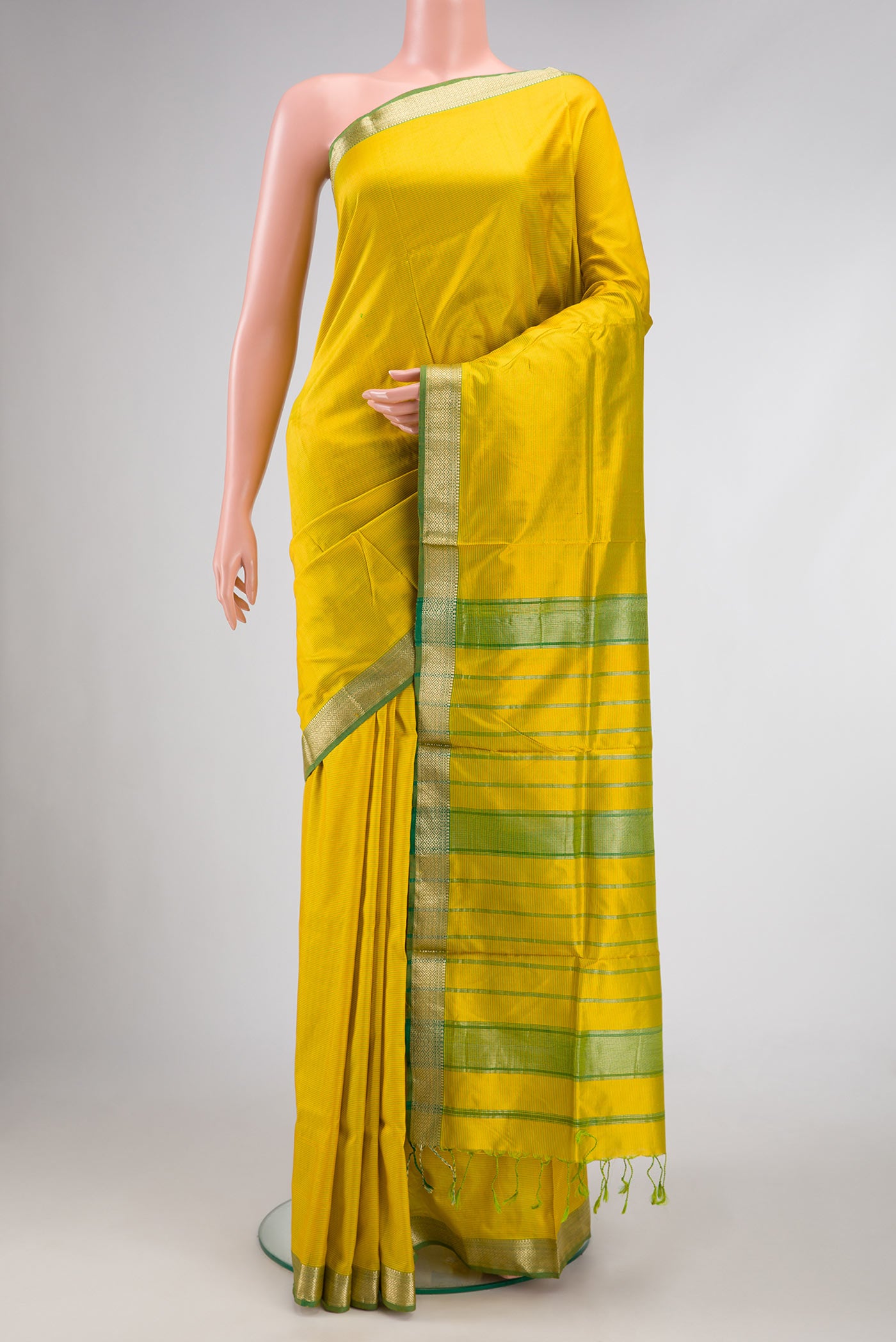 Lemon Yellow Dual Tone Maheshwari Silk Saree with Stripes on the body and Zari Border.  displayed on a mannequin