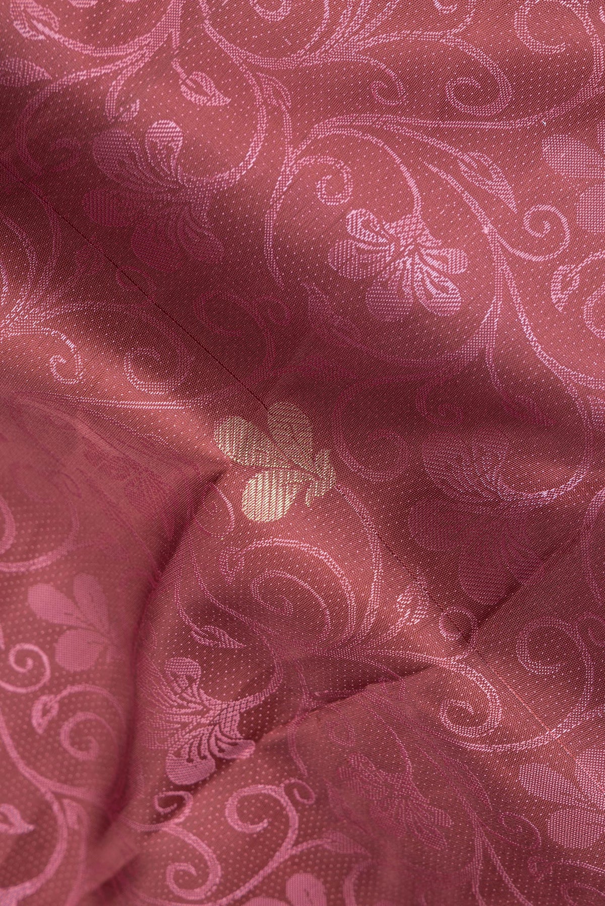 Close up of Pure Silk Brown Dual Tone Kanchipuram Saree with Jacquard With Zari Butta on the body and Fancy Border.  displaying folds