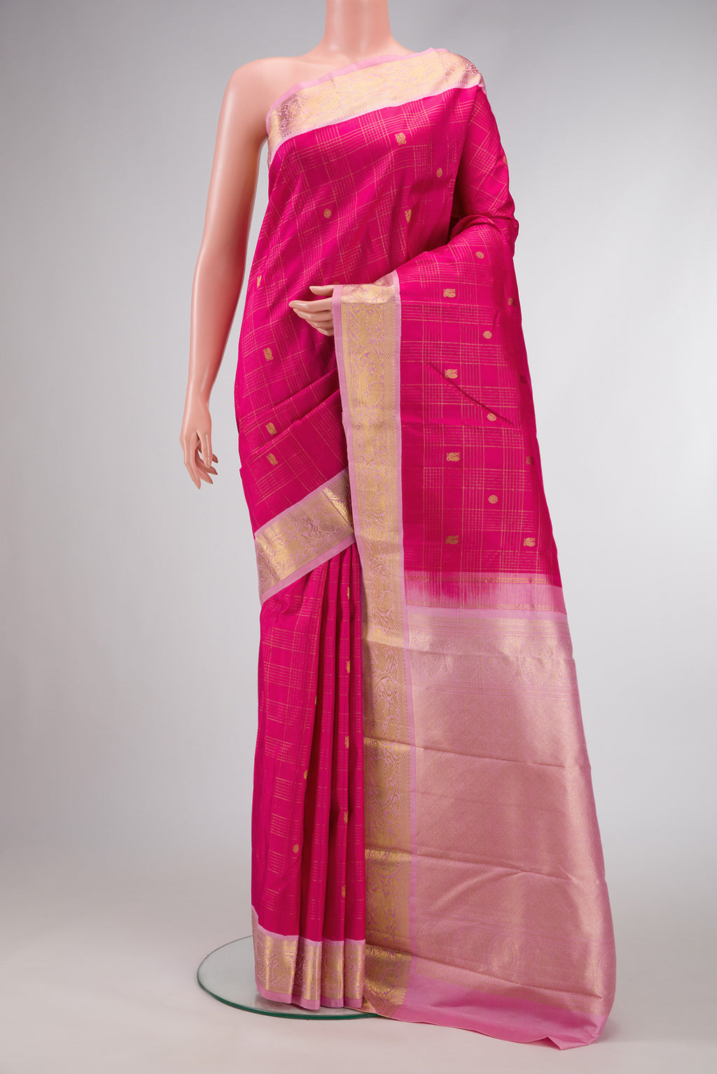 Dark Pink Dual Tone Kanchipuram Silk Saree with Zari Butta on the body and Zari Border.  displayed on a mannequin