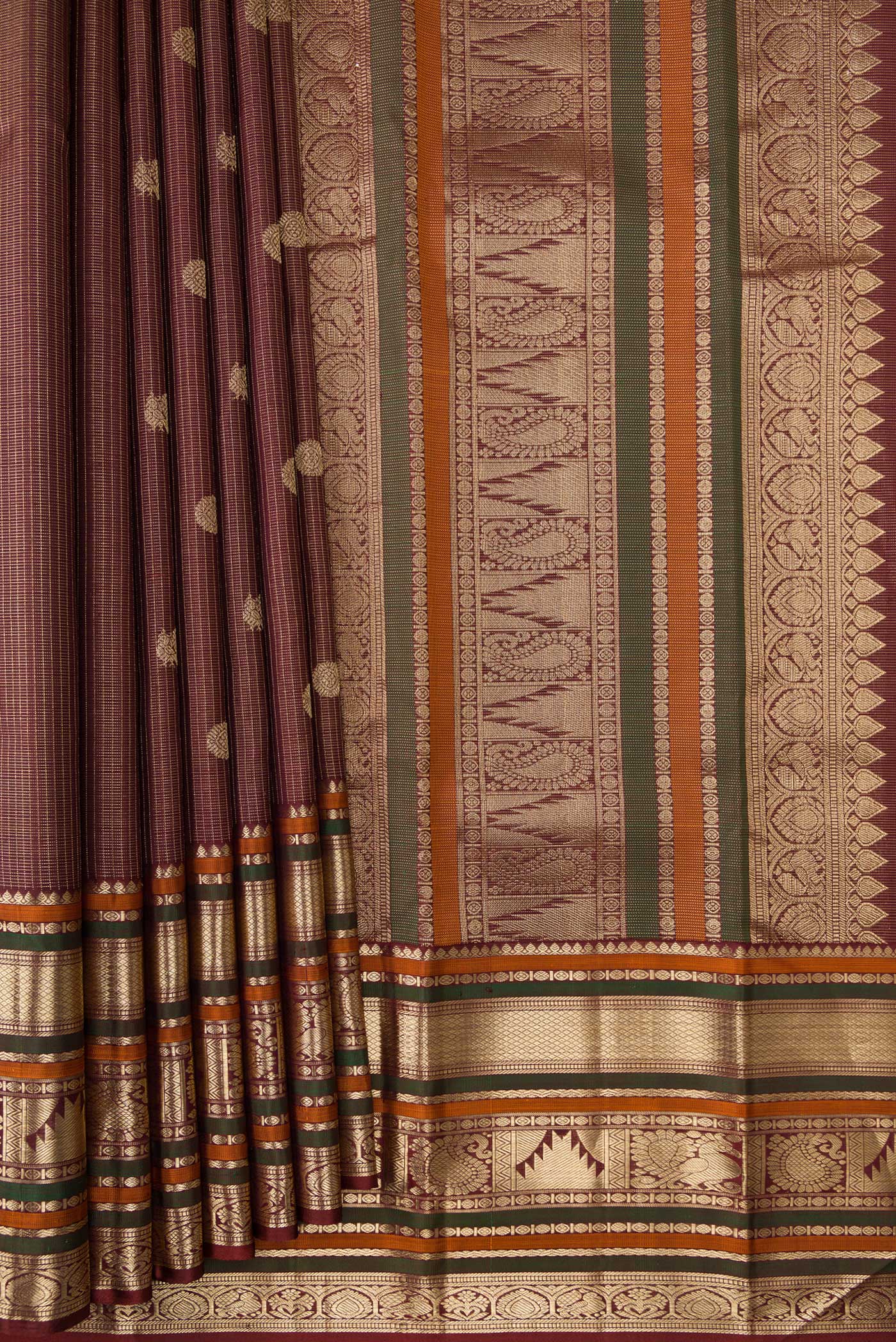 Pleats and pallu of Pure Silk Pure Zari Maroon Dual Tone Kanchipuram Saree with Checked design on the body and Zari Border. 